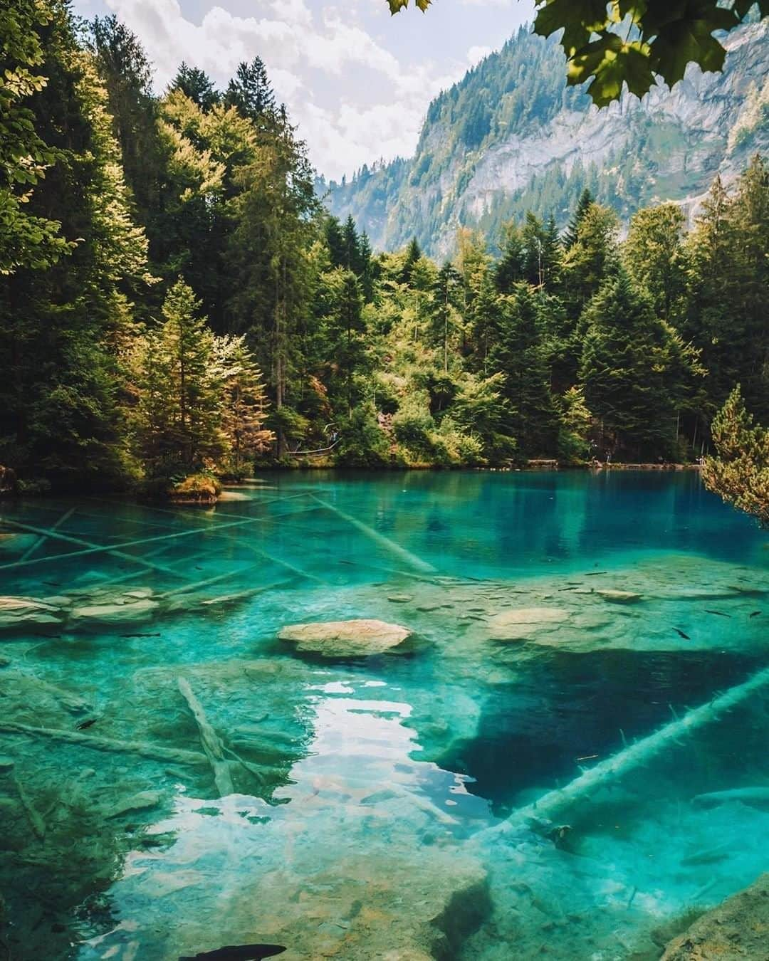 Travel + Leisureさんのインスタグラム写真 - (Travel + LeisureInstagram)「This striking blue-green lake is nestled in Switzerland's Kander Valley 💙 Get our Switzerland travel guide at the link in bio! #tlpicks courtesy of @lumadeline」8月16日 21時05分 - travelandleisure