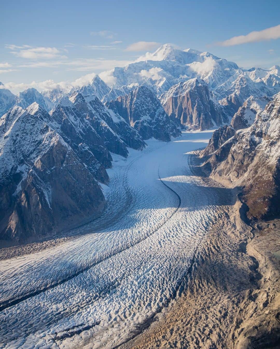 National Geographic Travelさんのインスタグラム写真 - (National Geographic TravelInstagram)「Photo by @tobyharriman | Taken from an amazing flight over the Alaska Range. On a rare clear day, you get to see the incredible Ruth Gorge Glacier leading up to the giant Mount Denali, the highest mountain peak in North America. Peaks from left to right are Mount Church, Mount Dickey, and Mount Denali. #alaska #alaskastories #climateaction」8月16日 22時00分 - natgeotravel