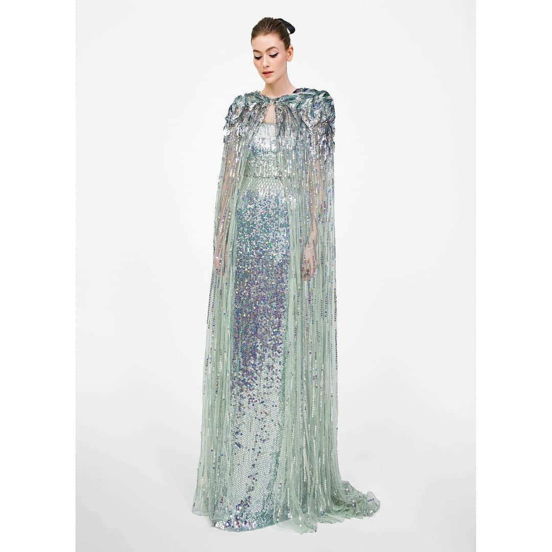 のインスタグラム：「Iridescent aquamarine sequins on the strapless Mirabelle gown and crystal Tempest cape from the AW19 Collection. Available at our London Flagship, on Mount Street, Mayfair. For further information on this style please call 020 7493 6295. #jennypackham #AW19 #instorenow #mirabelle #tempest #mountstreet」