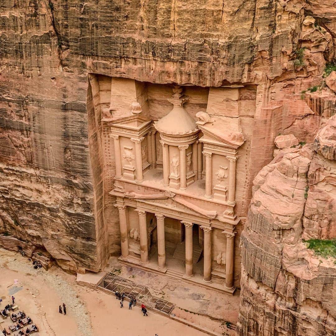 Lonely Planetのインスタグラム：「'#Petra is the reason most people put #Jordan on their travel wish list, and it turns out there’s much more to see in this awe-inspiring, ancient city than just The Treasury. Ranked as one of the new wonders of the world, the sprawling site is a hub of activity where camels and donkeys wander past handicraft stalls, steep staircases lead to centuries-old complexes, and hiking trails reward those who make the trek with spectacular views. To enjoy one of the best vantage points of The Treasury, take the Khubtha Trail all the way to the top then sip on a mint lemonade as you soak in the view.' – @globeguide -- Tap our link in bio to discover the rest of our top 10 countries for 2019, as well as info on visiting Petra responsibly.」