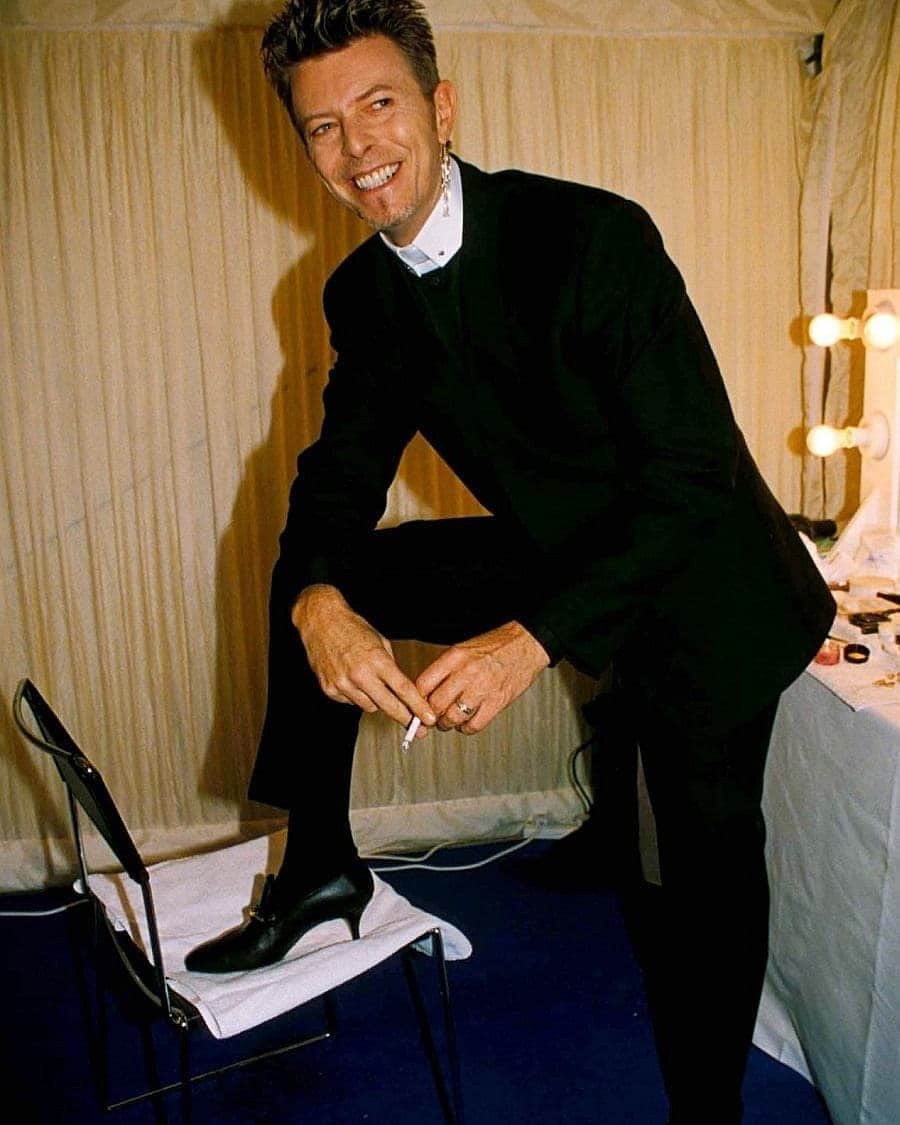 キャサリンハムネットのインスタグラム：「in response to a post by @styleanderror about men in heels - David Bowie wearing our logo snaffle kitten heels for men - from the AW96 Milan show. . . #meninheels #davidbowie #katharinehamnett #katharinehamnettlondon」