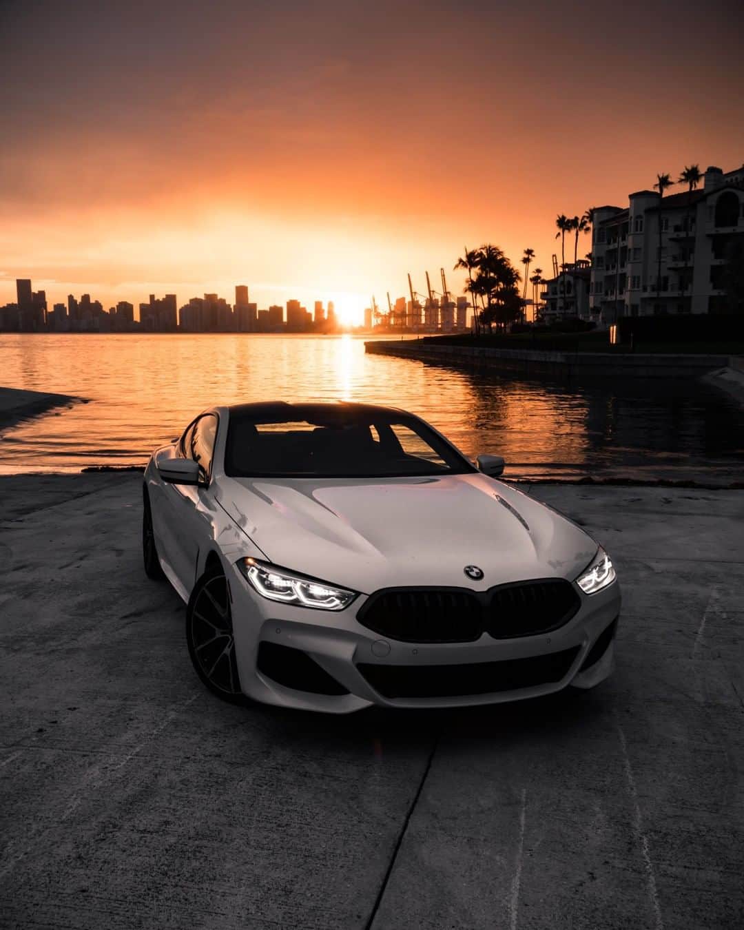 BMWのインスタグラム：「The epitome of luxury deserves an exclusive sunset. The BMW 8 Series Coupé. #THE8 #BMW #8Series #BMWrepost @Frankypuentes @Automotive_Design __ BMW M850i xDrive Coupé: Fuel consumption in l/100 km (combined): 10.0-9.9. CO2 emissions in g/km (combined): 227-224. The values of fuel consumptions, CO2 emissions and energy consumptions shown were determined according to the European Regulation (EC) 715/2007 in the version applicable at the time of type approval. The figures refer to a vehicle with basic configuration in Germany and the range shown considers optional equipment and the different size of wheels and tires available on the selected model. The values of the vehicles are already based on the new WLTP regulation and are translated back into NEDC-equivalent values in order to ensure the comparison between the vehicles. [With respect to these vehicles, for vehicle related taxes or other duties based (at least inter alia) on CO2-emissions the CO2 values may differ to the values stated here.] The CO2 efficiency specifications are determined according to Directive 1999/94/EC and the European Regulation in its current version applicable. The values shown are based on the fuel consumption, CO2 values and energy consumptions according to the NEDC cycle for the classification. For further information about the official fuel consumption and the specific CO2 emission of new passenger cars can be taken out of the „handbook of fuel consumption, the CO2 emission and power consumption of new passenger cars“, which is available at all selling points and at https://www.dat.de/angebote/verlagsprodukte/leitfaden-kraftstoffverbrauch.html.」