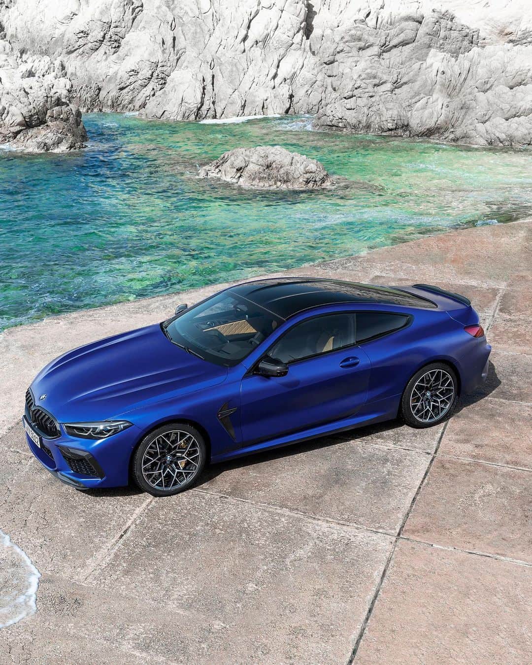 BMWのインスタグラム：「Watch closely. A true work of art and elegance. The first-ever BMW M8 Competition Coupé. #TheM8 #BMW #M8 #BMWM __ BMW M8 Competition Coupé: Fuel consumption in l/100 km (combined): 10.6. CO2 emissions in g/km (combined): 242.  Acceleration (0-100 km/h): 3.2 s. Power: 460 kW, 625 hp, 750 Nm. Top speed (limited): 250 km/h (with optional M Drivers Package: 305 km/h). Paint finish shown: BMW Individual Frozen Marina Bay Blue.  The values of fuel consumptions, CO2 emissions and energy consumptions shown were determined according to the European Regulation (EC) 715/2007 in the version applicable at the time of type approval. The figures refer to a vehicle with basic configuration in Germany and the range shown considers optional equipment and the different size of wheels and tires available on the selected model. The values of the vehicles are already based on the new WLTP regulation and are translated back into NEDC-equivalent values in order to ensure the comparison between the vehicles. [With respect to these vehicles, for vehicle related taxes or other duties based (at least inter alia) on CO2-emissions the CO2 values may differ to the values stated here.] The CO2 efficiency specifications are determined according to Directive 1999/94/EC and the European Regulation in its current version applicable. The values shown are based on the fuel consumption, CO2 values and energy consumptions according to the NEDC cycle for the classification. Further information on official fuel consumption figures and specific CO2 emission values of new passenger cars is included in the following guideline: 'Leitfaden über den Kraftstoffverbrauch, die CO2-Emissionen und den Stromverbrauch neuer Personenkraftwagen' (Guide to the fuel economy, CO2 emissions and electric power consumption of new passenger cars), which can be obtained free of charge from all dealerships, from Deutsche Automobil Treuhand GmbH (DAT), Hellmuth-Hirth-Str. 1, 73760 Ostfildern-Scharnhausen and at https://www.dat.de/co2/.」