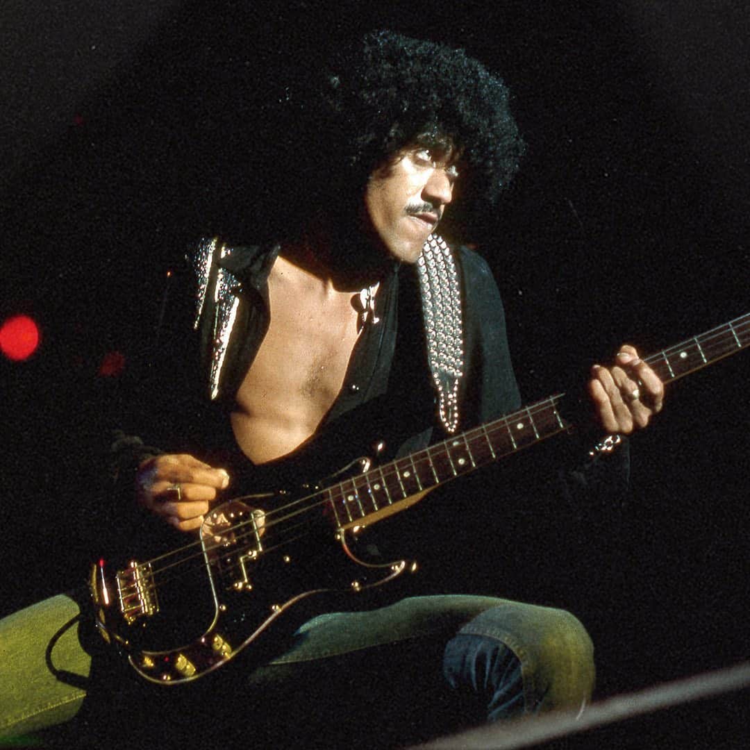 Fender Guitarさんのインスタグラム写真 - (Fender GuitarInstagram)「Few images in ‘70s rock lore are as stirring as Phil Lynott wearing his aviator shades and hoisting his P Bass above the crowd at a Thin Lizzy show. On what would be the iconic bassist's 70th birthday, we’re excited share the release of this Limited Edition Phil Lynott Precision Bass. Complete with a hand-wound ’78 P Bass split-coil pickup and signature mirrored pickguard, this limited-edition bass was painstakingly recreated by Master Builder John Cruz as a faithful replica of the Thin Lizzy era original – with extras including mirrored aviator glasses, a studded wristband and custom Anvil case. Click the link in bio for more. @johncruz_fendercustomshop @fendercustomshop」8月21日 1時12分 - fender