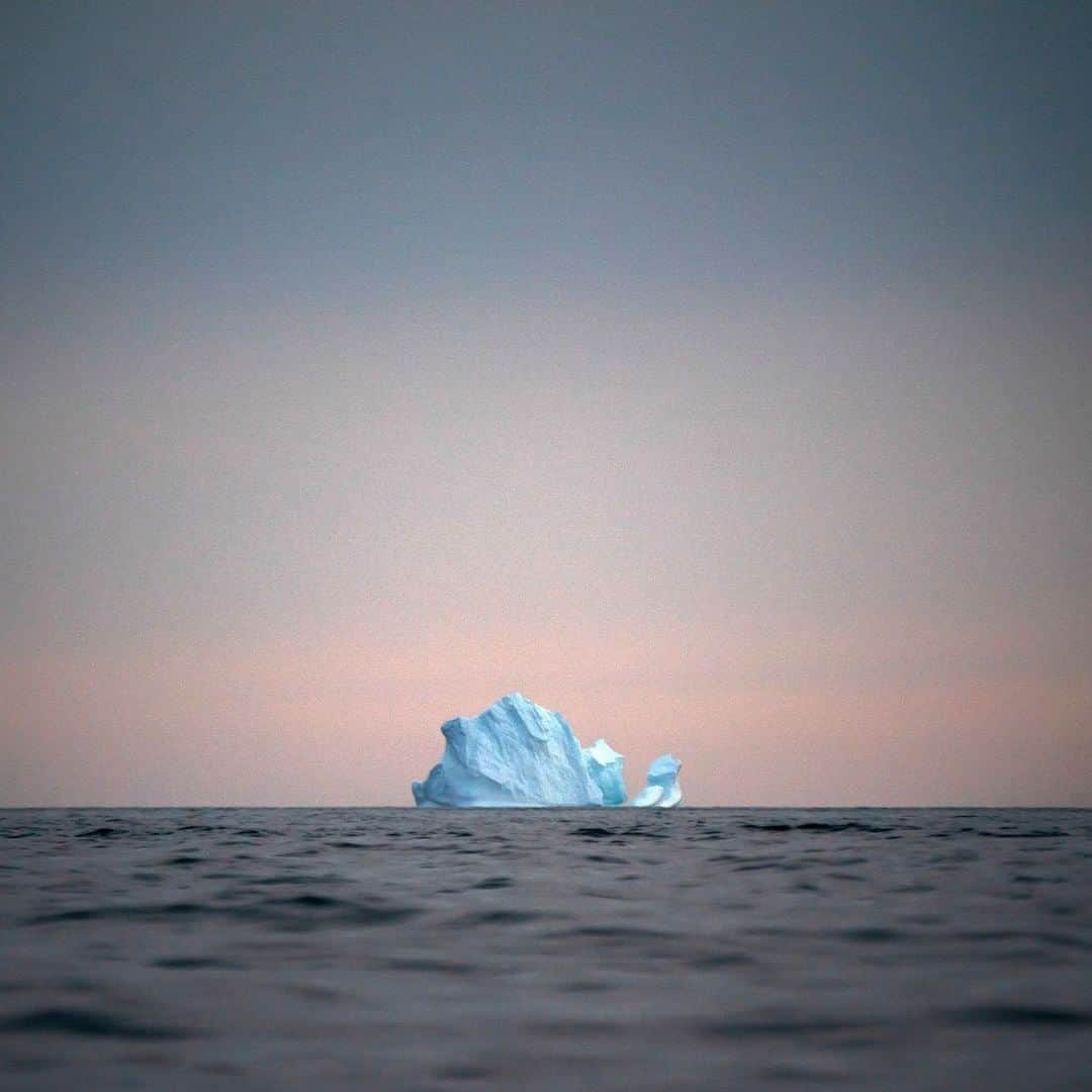 TIME Magazineさんのインスタグラム写真 - (TIME MagazineInstagram)「A large iceberg floats away as the sun sets near Kulusuk, #Greenland, on Aug. 15. Scientists are hard at work there, trying to understand the alarmingly rapid melting of the ice amid record-shattering heat. From July 31 to Aug. 3, the Associated Press reports, more than 58 billion tons (53 billion metric tons) of ice melted there. That's more than 40 billion tons above the average for this time of year. By the end of the summer, scientists estimate that some 440 billion tons (400 billion metric tons) of ice (or more) will have either melted or broken off Greenland's giant ice sheet. Read more at the link in bio. Photograph by @felipedana—@apnews」8月21日 5時33分 - time