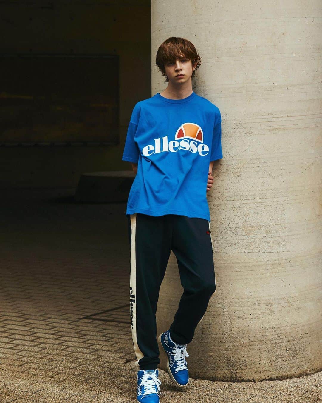 のインスタグラム：「2019 FALL NEW LOOK  Heritage Logo Tee  スポーツmixスタイルにおすすめの定番Tシャツ。着やすさと機能のバランスを兼ね備えたコットン65%、ポリエステル35%の素材を開発。汗をかく肌面にポリエステル糸を多く配置しドライ感と耐久性を向上。  詳しくはトップページ、リンクよりご覧いただけます。 https://www.goldwin.co.jp/ellesse/?category=heritage #ellesse #ellesseheritage #エレッセヘリテージ #2019fw #エレッセ #ロゴt #tシャツ #newlook #newlook #autumn」