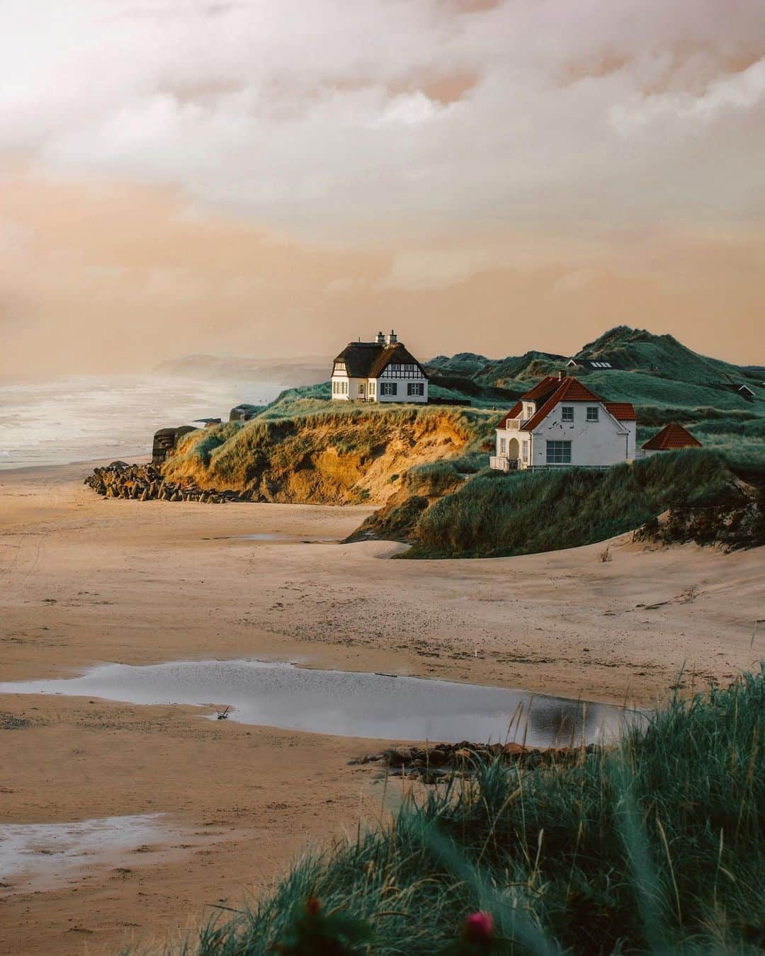 Simone Bramanteのインスタグラム：「{ At the Edge } • A nice guy sent me an email this morning, wondering if this place really exists, because he found my photo on the @govisitdenmark website.  This dreamlike place is a called Løkken, on the west coast of Denmark. I waited in the rain - to take this picture - for about ten minutes, when the Sun passed through the clouds for a few seconds.」