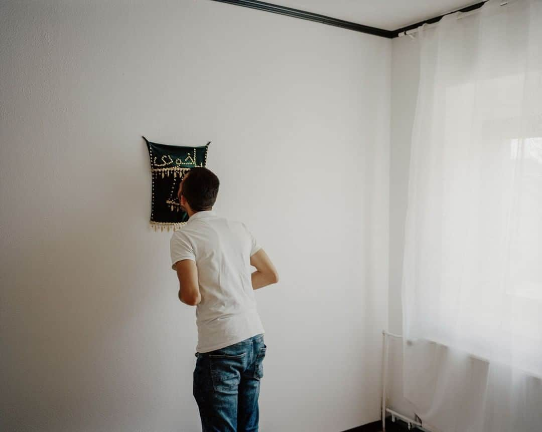 TIME Magazineさんのインスタグラム写真 - (TIME MagazineInstagram)「Walid Khalil Murad prays and kisses a shrine to his family that hangs on a wall of his home in Theley, southern #Germany, on July 25. Murad owned two shops in the Iraqi city of Sinjar before ISIS forced his #family to flee. In 2015, their smuggler’s boat went beneath the waves with his wife and three children trapped in the cabin. Many obstacles stand between Murad, 34, and the truth. After years of lobbying, an international organization has persuaded some countries to start work on identifying the dead using DNA #technology—and finally giving their families some form of closure. In these politically-volatile times, when nationalist parties have made inroads across #Europe, the International Commission on Missing Persons’s task is even more difficult. The countries that have found #migrant bodies on their soil would, in theory, take DNA samples and any other identifying characteristics and upload this information to a centralized database maintained by the ICMP. Meanwhile, anyone searching for a missing relative would fill in a form and give a DNA sample using a simple saliva or pin-prick blood test that can be done at home. The results are uploaded to a second database, and the two data sets are then compared for matches. But none of this will happen without the full support of the governments involved. For relatives of the dead like Murad, the political hostility and lack of empathy shown by countries like Italy feels like yet another indignity. “I want you to put yourself in my place, not for a day, just for one minute," Murad says. "Just imagine that you lost your family the same way I lost my family." Read more at the link in bio. Photograph by @mustafahabdulaziz for TIME」8月27日 22時55分 - time