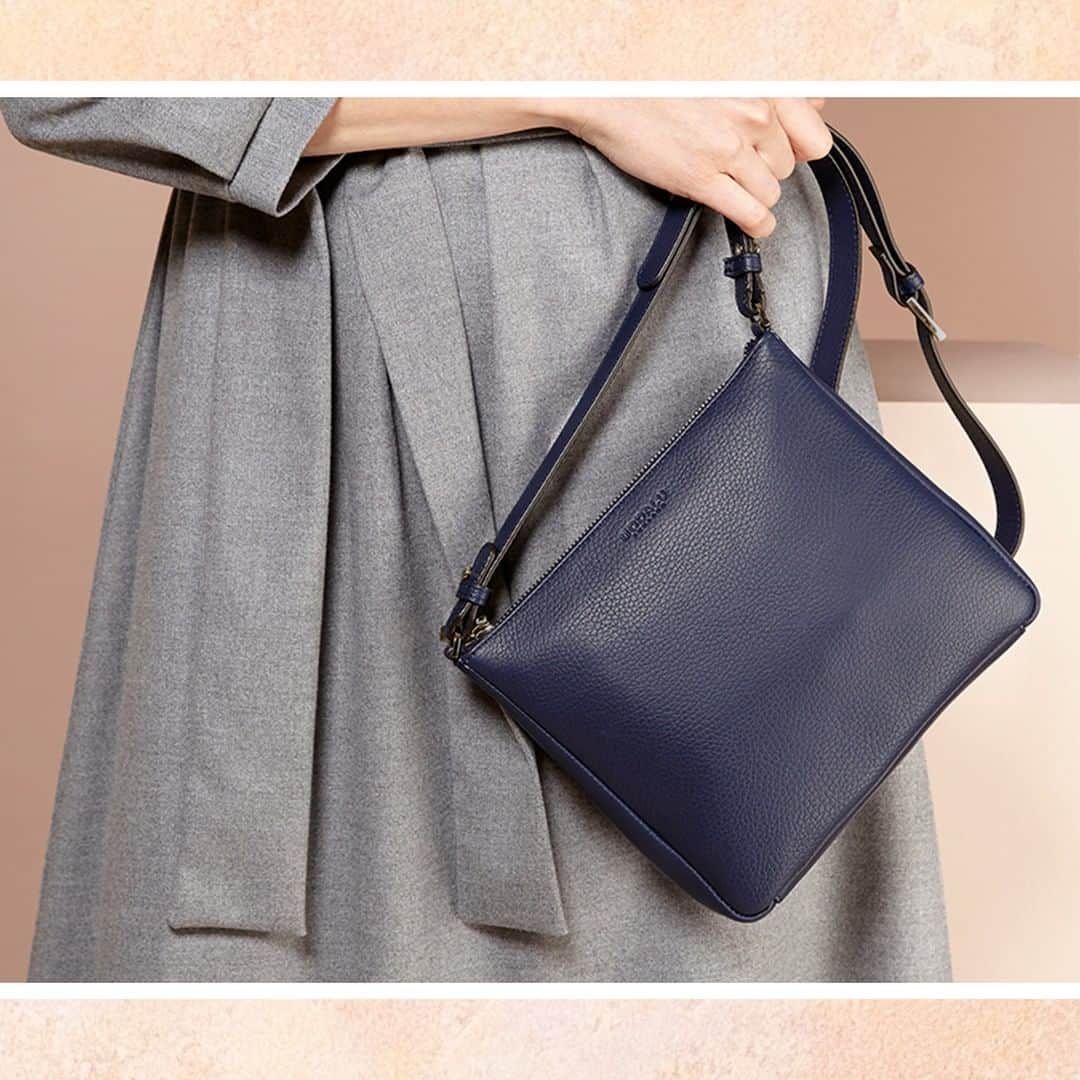 モダルーのインスタグラム：「The Elsa crossbody is available in a neutral navy hue for a sleek, sophisticated and versatile silhouette #ModaluMoments #LeatherHandbags #Handbags」