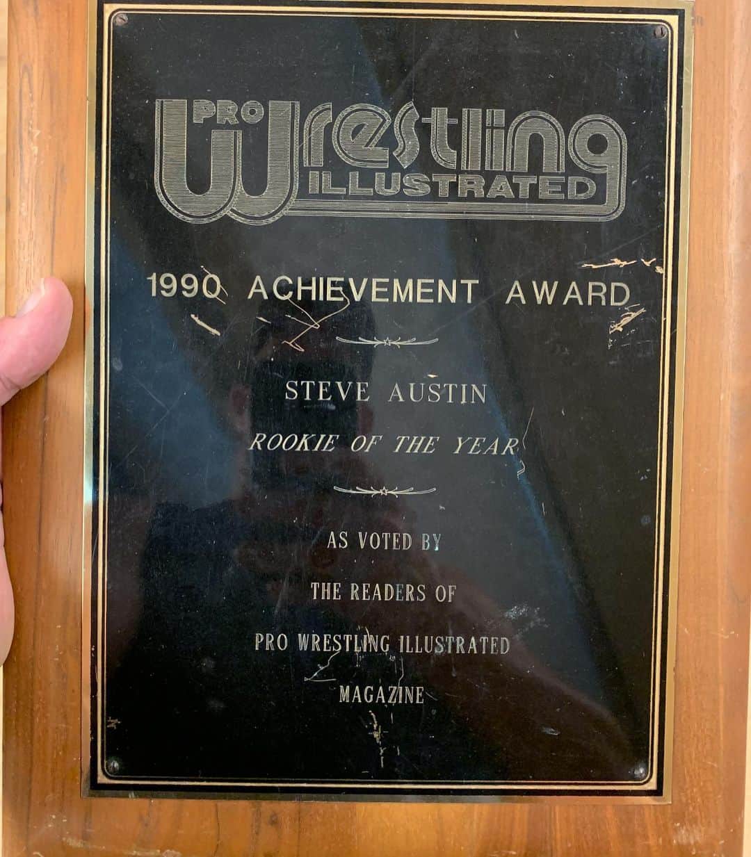 ストーン・コールド・スティーブ・オースチンのインスタグラム：「Couple of #tbt pics. I get asked all of the time if I still have my Rookie of the Year award from 1990. Yes, I do. Found it today going thru some boxes. Scratched all to hell from moving around, but it’s still in one piece. Up until 1990 that was the highlight of my life as far as working.  Picture 2 is the day I received it.  Pic 3 is myself and my tag team partner in Dallas, TX. The California Stud Rod Price.  Pic 3 is me photo bombing Shawn Michaels and Chyna.  Pic 4 is myself and Chyna before a house show somewhere on the road.  #prowrestling #goodtimes  #tbt」
