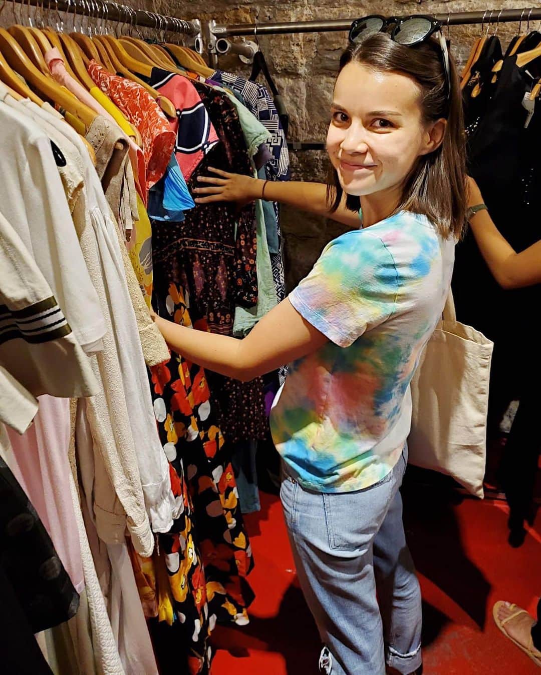 のインスタグラム：「Growing up, I always had strong opinions about how I dressed. The thing I cared about most was being comfortable and feeling like myself - pretty simple. As I got older, things started to change, especially when social media came around. I started to feel pressure to have things I didn’t *really* want or need. As I started making my own money, I felt even more pressure to buy expensive things, keep up with trends and project this image of “I’m a boss!” (aka bosses have fancy things, so I must have fancy things!) It was an exhausting, empty experience filled with constant anxiety and an obsessive pursuit of perfection. I realized I was hurting myself, so I decided to make a change. I’ve spent the last two years reevaluating my shopping habits in small steps and asking myself questions like: Why do you feel the need to shop? Are you using shopping to avoid something? Are you trying to please other people? Is this trend something you actually want to experiment with? How can you shop your closet and restyle things you already have? For me, getting dressed is a creative experience and the pressure to “keep up” robbed me of that process. Now, I save shopping for special occasions or when I really need something. When I do shop, I mostly shop secondhand. I treasure the wardrobe I have and I love figuring out new ways to wear things. I pay attention to moments when I think “Oh, it would be so cool to have X!” and wait to see if it’s fleeting or something I continue to think about for months. I know what I’m spending my money on and the deeper why. I don’t feel guilt or regret after a purchase. Most importantly, I allow myself to play! The photos above were taken at a vintage store in Paris. I’m wearing a tie dye shirt I made myself and I’m moments away from being THRILLED about my finds: a winky face sweatshirt and a piece I’m calling “cool art teacher duster.” The pleased smile you see is a real one - it’s the little girl inside of me I ignored for years in order to be more of an “adult.” The little girl who’s very much alive and has been right about a lot of things all along. Thanks little Ingrid, you’re the REAL boss and I love you.❤️」