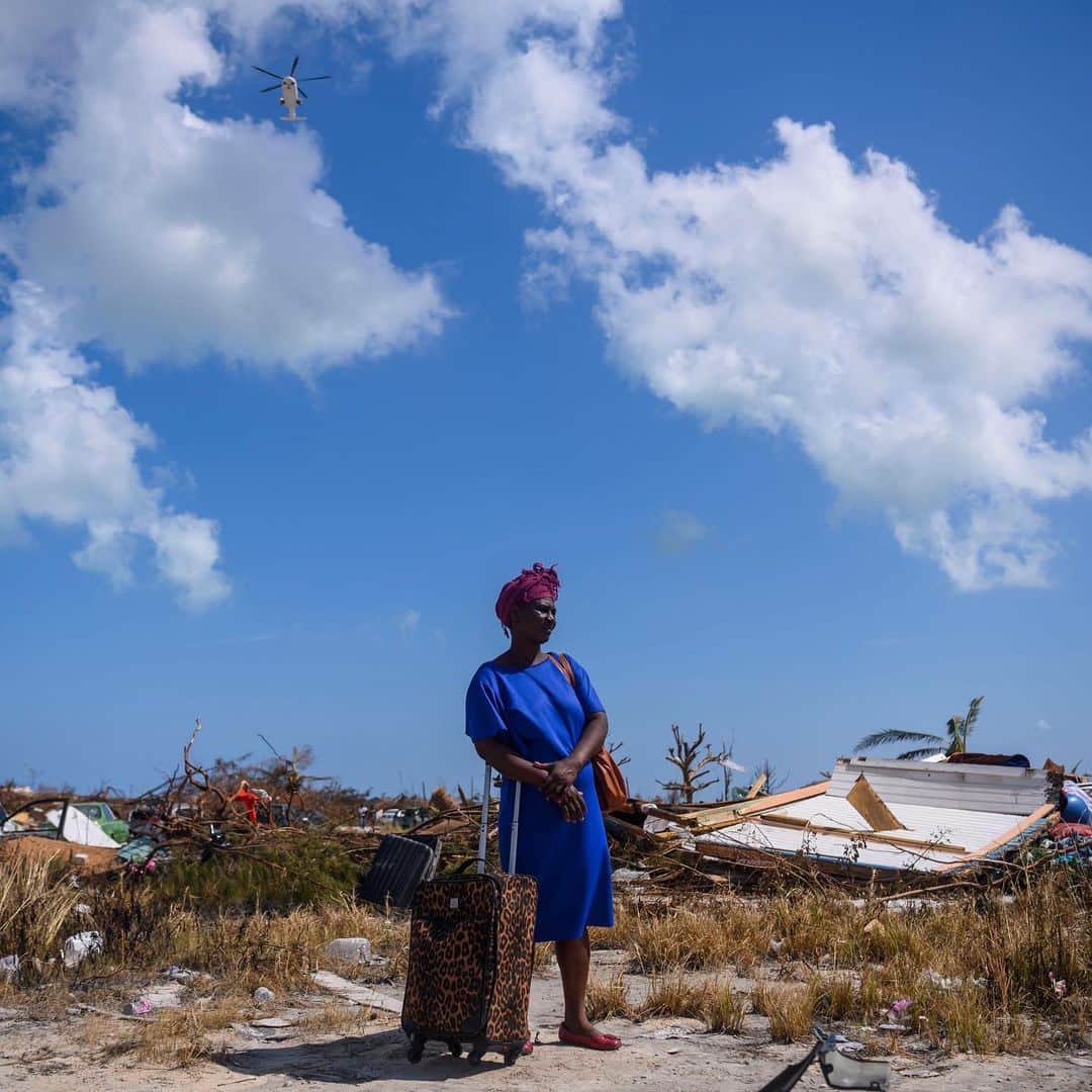 TIME Magazineさんのインスタグラム写真 - (TIME MagazineInstagram)「Since Hurricane Dorian tore through the #Bahamas—leveling homes, drowning animals and leaving at least dozens of people dead—it seems like survivors are in the midst of an “apocalypse.” That's how Brian Symonette described the aftermath of the Category 5 storm to TIME as he traveled around Great Abaco Island to get supplies and care for his family. As the scale of the destruction shifts into focus, Symonette says the island is running out of food, water and fuel: “All the banks are gone, all the grocery stores are gone. I haven’t spent money in six days. It’s just been trade—‘O.K., you have gas, I have a truck. You have food, I have somewhere to stay.’” The 34-year-old adds, “the tune of everyone is, ‘I want to wake up from this nightmare.’” Read more at the link in bio. In these photographs, vehicles drive on a flooded road on Great Abaco Island on Sept. 5, and Dejani Louistan stands with the only belongings she managed to salvage in the Mudd neighborhood of Marsh Harbour on Sept. 7. Photographs by Carolyn Van Houten (@vanhoutenphoto)—@washingtonpost/@gettyimages」9月8日 19時46分 - time
