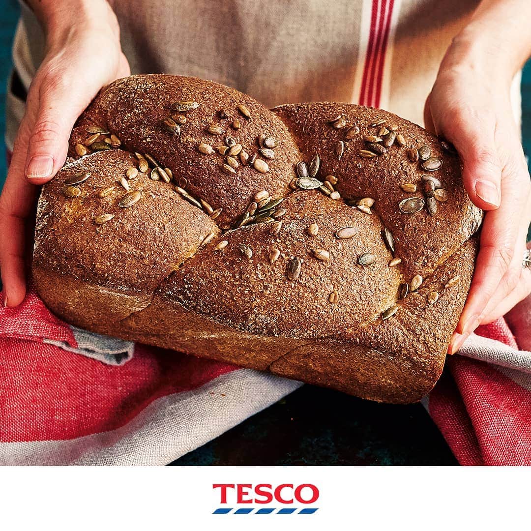Tesco Food Officialさんのインスタグラム写真 - (Tesco Food OfficialInstagram)「Think you could RISE to last night’s #GBBO bread challenge? The freshly-baked aromas of a wholemeal spelt loaf are sure to take you back - it’s a super simple #BakeOff idea full of wholesome goodness. ​ ​Ingredients 450g wholemeal bread flour 150g wholemeal spelt flour 7g sachet fast-action dried yeast 1 tsp salt 1 tbsp clear honey 1 tbsp pumpkin seeds 1 tbsp sunflower seeds ​Method Combine 450g wholemeal bread flour, 150g wholemeal spelt flour, 1x 7g sachet fast-action dried yeast and 1 tsp salt in a large mixing bowl. Add 1 tbsp clear honey and 430ml tepid water, and mix with a wooden spoon until no dry flour remains. Cover loosely and leave to one side for 10 minutes. Turn the dough out onto a lightly floured surface and knead for 10-15 minutes, until elastic. If you are using an electric mixer, kneading time can be halved. Put the dough in a bowl, cover and leave to rise for 60-90 minutes, or until doubled in size. Grease a 900g loaf tin with 1 tsp sunflower oil and line with nonstick baking paper. On a lightly floured surface, knock the air out of the dough with your fist. Flatten into a rectangle to roughly fit your tin. Cut lengthways into 3, leaving the top end intact, then plait together. Read more at Transfer the dough to your lined tin. Cover loosely with clingfilm or a tea towel; leave to rise for 40-60 minutes, until bigger but not quite doubled in size. After 30 minutes, preheat the oven to gas 9, 240°C, fan 220°C and put a baking tray on the bottom tray. When the dough has risen, brush with water and sprinkle over the 1 tbsp pumpkin seeds and 1 tbsp sunflower seeds. Put in the centre of the oven and pour a cup of cold water into the hot baking tray below. Turn the oven down to gas 7, 220°C, fan 200°C, and bake for 35 minutes. Remove the loaf from its tin and return to the oven for a further 10-15 minutes, until a deep golden brown colour. Leave to cool completely on a wire rack before serving.」9月11日 19時06分 - tescofood