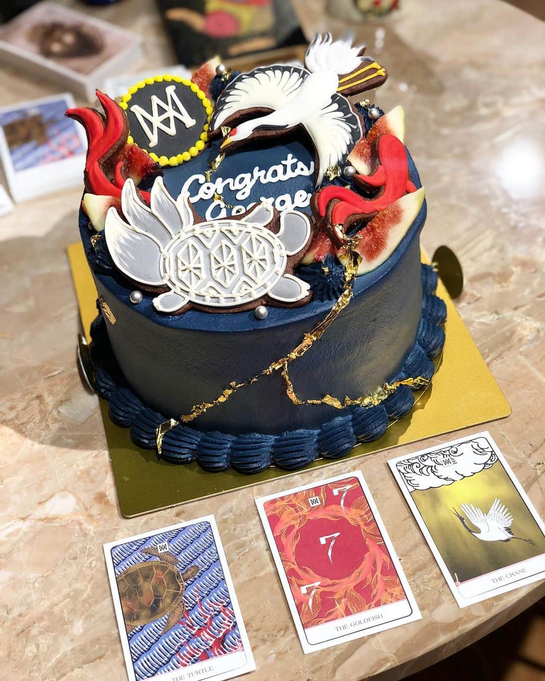 稲木ジョージのインスタグラム：「@milamorejewelry inspired surprise cake from @fashion_bba 😍❤️ The Spirit Animals, Kintsugi and Milamore navy blue! Very on brand lol」