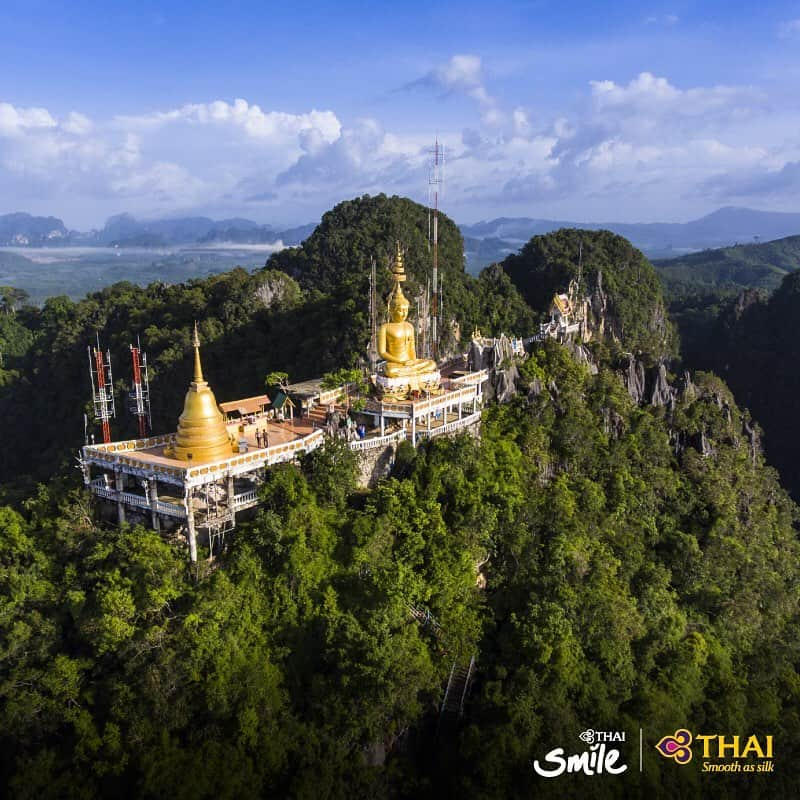 タイ航空さんのインスタグラム写真 - (タイ航空Instagram)「Wat Tham Suea is a famous religious site in Krabi, Thailand, most notably for its location atop a hill, which visitors must climb 1,237 steps of stone stairs to reach. At the hilltop is where visitors can pray to a giant Buddha statue and enjoy a panoramic view of Krabi. Legend has it that a cave around the foot of the hill used to be a tiger's lair, but the beast was eventually gone after a monk on a pilgrimage took a stop around the area, and the locals, out of faith in the monk and the Buddha, built a temple on the hill, hence the name "Wat Tham Suea" or Tiger Cave Temple. . #ThaiAirways #WatThamSuea #TigerCaveTemple #Krabi #FlyTHAItoThailand #FlyTHAItoKrabi #AmazingThailand」9月12日 22時12分 - thaiairways