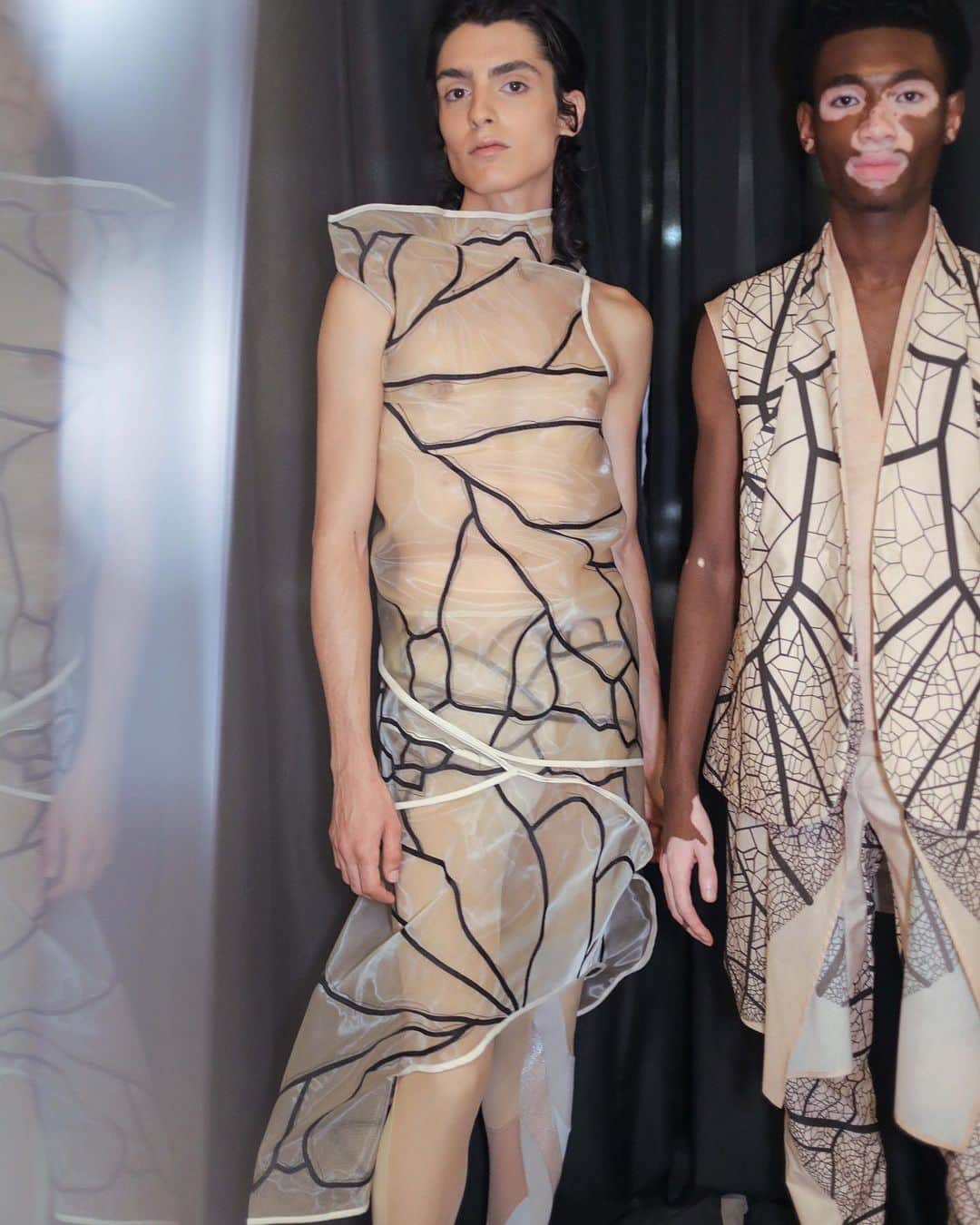 スリーアズフォーのインスタグラム：「Happy to share our latest collection:”Human plant” spring summer 2020 So honored to have our dear photographer friend @schohaja photograph our backstage ! Capturing @yvesmark.chery and @maxima_cortina in this picture, Thank you everyone that was a part and helped to make our show #threeasfour happen: casting @barbarapfister @style360nyfw @klarna @klarna.usa @skechers @rado @jvincentmakeup @nymbrands sound: @benbrunnemer  animation film/ show visuals @brainclosed @georgiastudio production @isewhitestylist @marcelokrasilcic studio team : @autumnbeckens [Studio Team] Nina, Alex, Yi Hsuan, Viola, Sarah, Lilly, Wen-Shin, Yuchen, Michelle,Samyukta, Dante, Laureline, Chandler, Natalia, Annie, Paolo, Mark , Ti and Philip wyatt , @showroomseven @mandieerickson all our beautiful models and their agents and the universe ! 🙏🏻🙏🏻🙏🏻 #humanplant #human #plant #ss2020 #nyfw #fashionweek #fashionweeknyc #backstage #threeasfour」