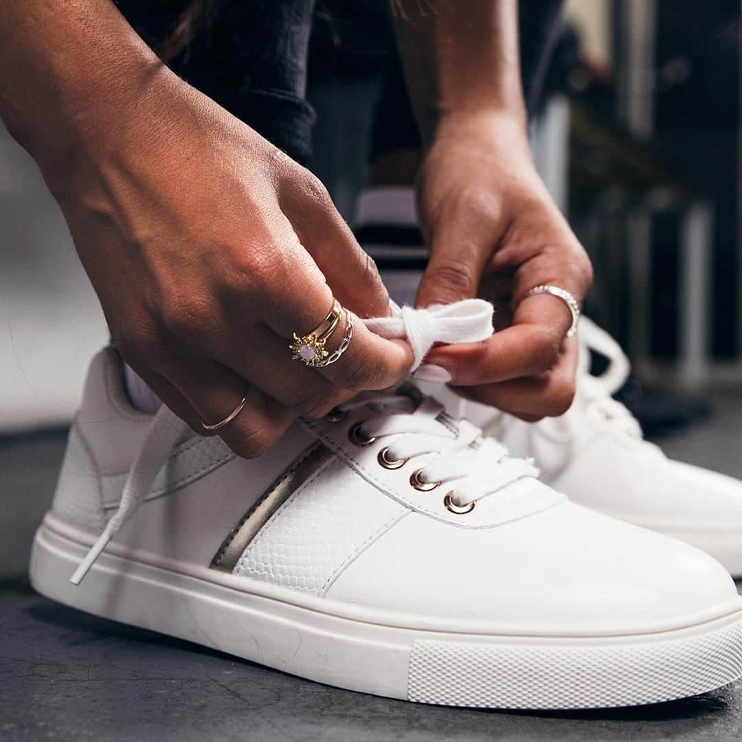アクセサライズのインスタグラム：「Put your best foot forward with a new pair of fresh white trainers. This pair are detailed with a fun gold stripe, for a an eye catching effect. 🔍: Trainers - 7951201041 🔍: Ring - 7940398150  Tap the link in the bio to shop now.  #Accessorize #Accessorizer」