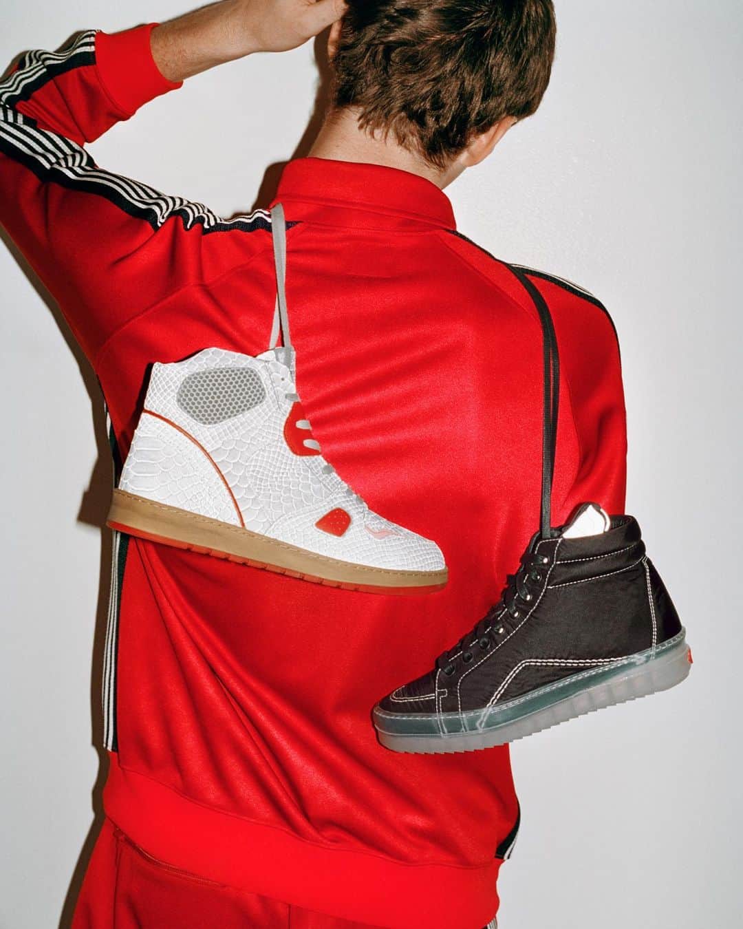 バーニーズ・ニューヨークのインスタグラム：「Which would you wear with this all red @needles.jp track suit? White snakeskin embossed @alesgrey high tops or the black tech-knit @rhude sneakers? Vote below to show us your style.」