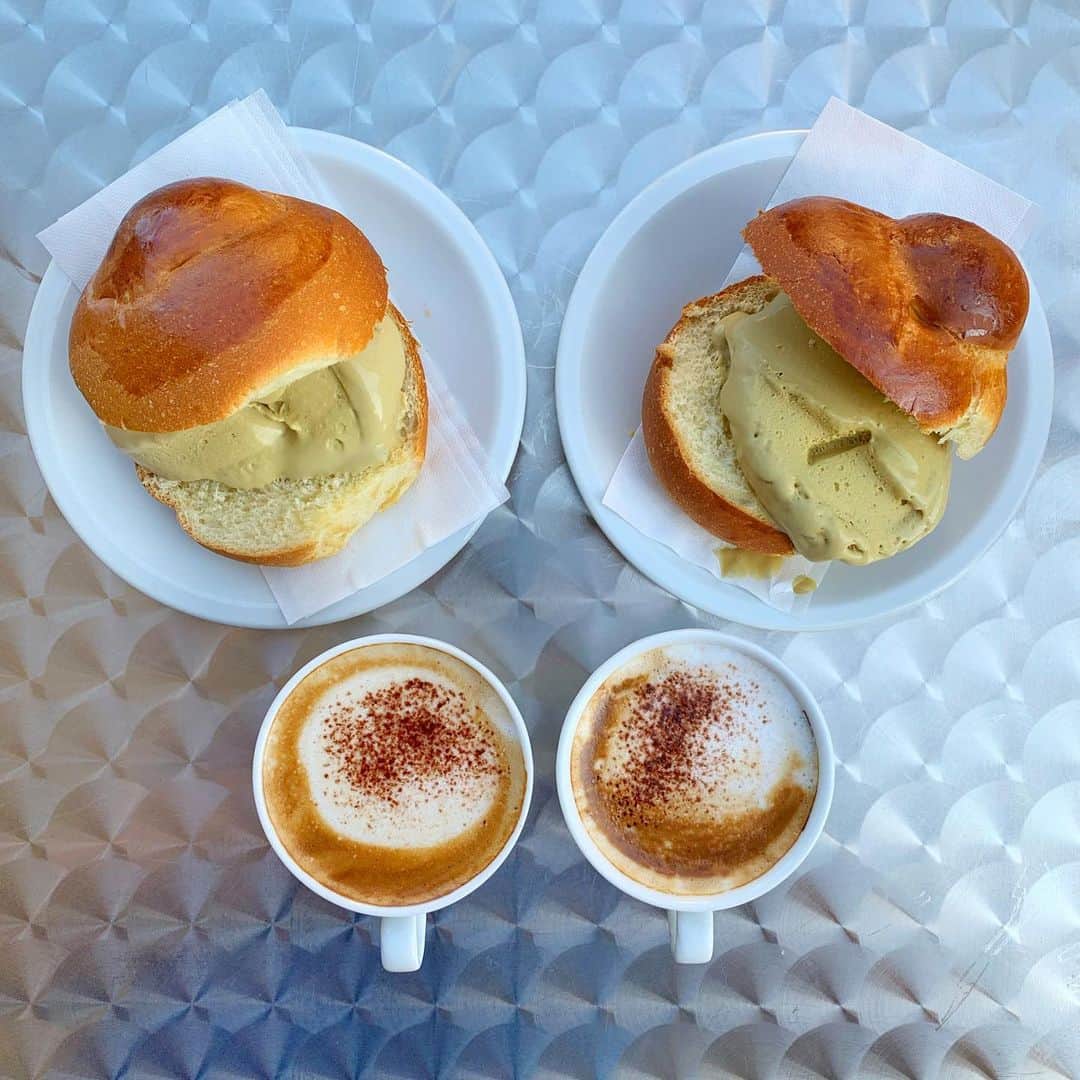 Symmetry Breakfastのインスタグラム：「Brioche con gelato @rosybar.modica in Sicily 🇮🇹 breakfast like a Sicilian with a small cappuccino ❤️ Pistachio gelato should never ever be lurid green, but a kind of muddy green colour, Rosy Bar has maybe some of the best I’ve ever tasted! - - - - - - - - - - - - - - - - - We are in Sicily for the birthday of one of my oldest friends Adrianna! Hanging out and drinking wine has been high on the agenda, but yesterday we went wild swimming in Laghetti di Cave Grande (the last few images on the carousel) #symmetrybreakfast #sicilia #italianfood #italianbreakfast」