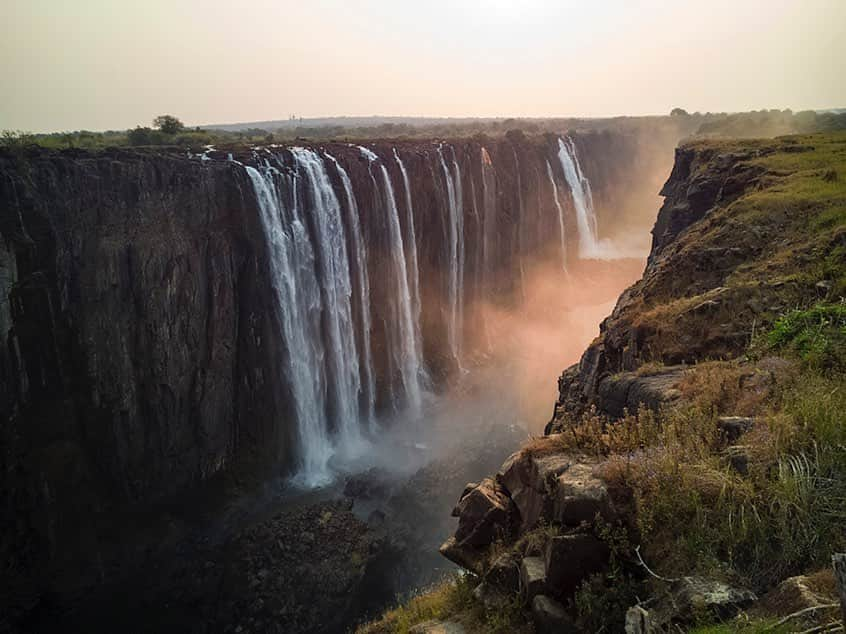 National Geographic Creativeさんのインスタグラム写真 - (National Geographic CreativeInstagram)「Photo by @salvarezphoto | Sunrise illuminates the mist of Victoria Falls, Zimbabwe. The falls generate mists that can be spotted from more than a dozen miles away. #VictoriaFalls #Zimbabwe #Waterfall」9月19日 5時50分 - natgeointhefield