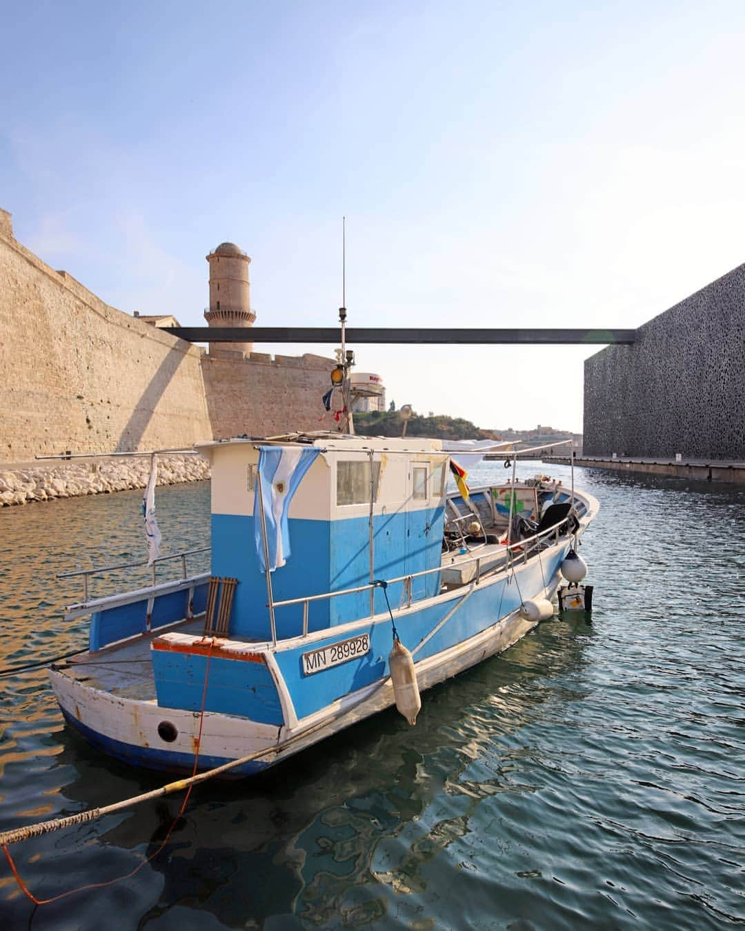 Rich McCorさんのインスタグラム写真 - (Rich McCorInstagram)「AD| Continuing my images from around France earlier this year I also ventured down to Marseille to visit @mucem_officiel, an unashamedly bizarre and eye-grabbing structure next to the harbour. I’d seen images of the museum online and I thought they were renders because it’s intricately designed shell looks surreal but the whole thing is very real including the gravity defying 130m long bridge (reimagined as a plank here) that links the museum to Fort Saint-Jean. I’m usually all for a wander around a museum but I only briefly spent time inside because it was the exterior that fascinated me, even more so at dusk when tiny blue lights in the latticework begin to sparkle and dance on the Mediterranean waters below #ExploreFrance #Mucem #Marseille」9月20日 20時07分 - paperboyo