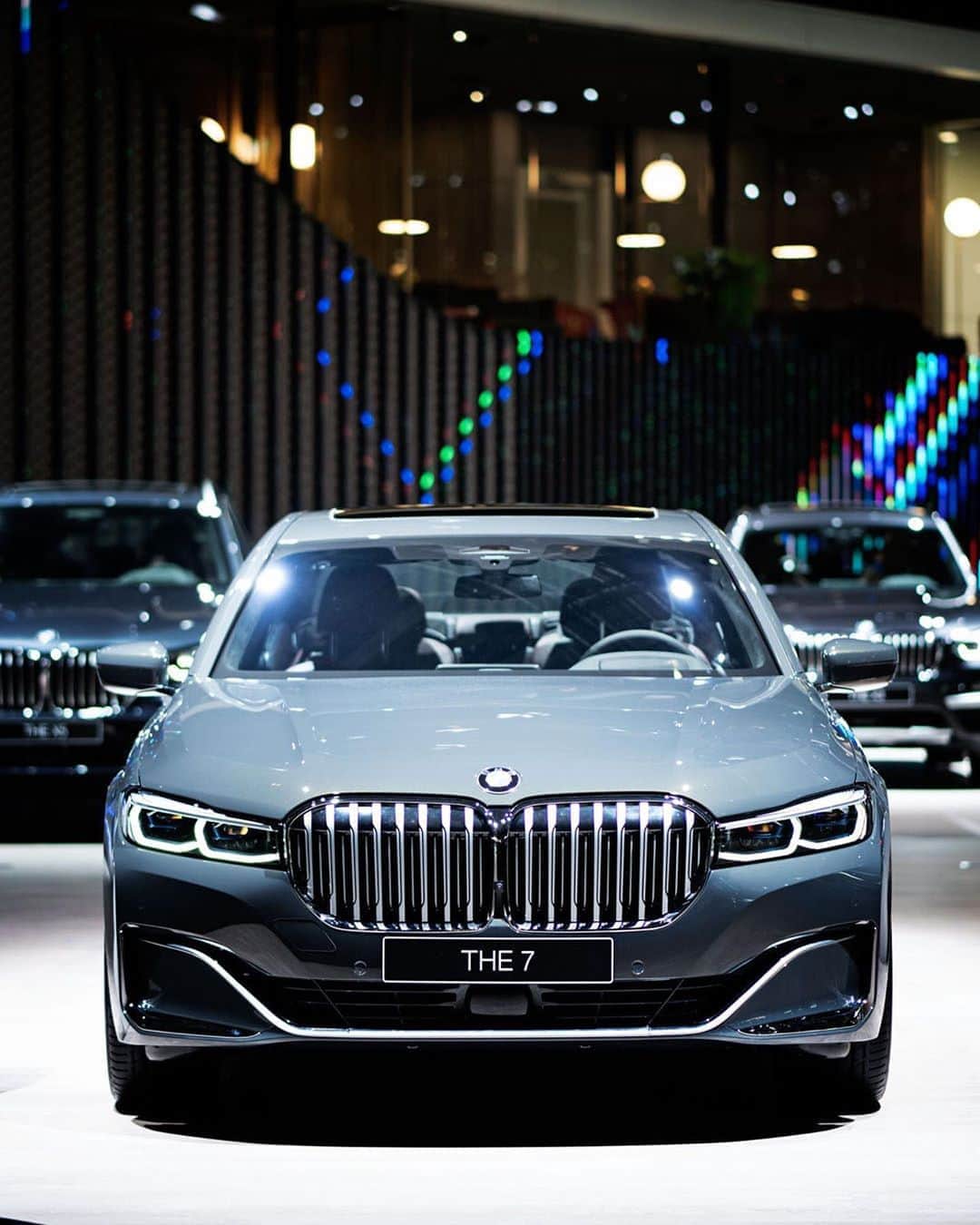 BMWのインスタグラム：「Elegant. Electrifying. Magnificent. The BMW 7 Series Sedan. #THE7 #BMW #7Series #BMWi #BMWIAA  __ BMW 745e Sedan: Energy consumption in kWh/100 km (combined): 15.5–15.1. Fuel consumption in l/100 km (combined): 2.2–2.1. CO2 emissions in g/km (combined): 51–48.  Acceleration (0-100 km/h): 5.2 s. Power: 290 kW, 394 hp, 600 Nm. Top speed (limited): 250 km/h.  The values of fuel consumptions, CO2 emissions and energy consumptions shown were determined according to the European Regulation (EC) 715/2007 in the version applicable at the time of type approval. The figures refer to a vehicle with basic configuration in Germany and the range shown considers optional equipment and the different size of wheels and tires available on the selected model. The values of the vehicles are already based on the new WLTP regulation and are translated back into NEDC-equivalent values in order to ensure the comparison between the vehicles. [With respect to these vehicles, for vehicle related taxes or other duties based (at least inter alia) on CO2-emissions the CO2 values may differ to the values stated here.] The CO2 efficiency specifications are determined according to Directive 1999/94/EC and the European Regulation in its current version applicable. The values shown are based on the fuel consumption, CO2 values and energy consumptions according to the NEDC cycle for the classification. Further information on official fuel consumption figures and specific CO2 emission values of new passenger cars is included in the following guideline: 'Leitfaden über den Kraftstoffverbrauch, die CO2-Emissionen und den Stromverbrauch neuer Personenkraftwagen' (Guide to the fuel economy, CO2 emissions and electric power consumption of new passenger cars), which can be obtained free of charge from all dealerships, from Deutsche Automobil Treuhand GmbH (DAT), Hellmuth-Hirth-Str. 1, 73760 Ostfildern-Scharnhausen and at https://www.dat.de/co2/.」