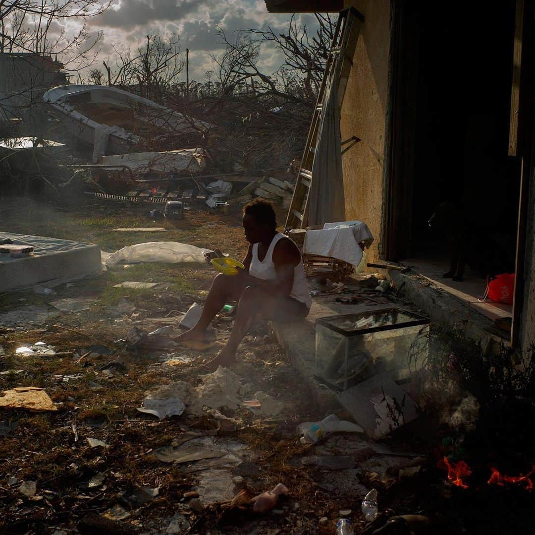 TIME Magazineさんのインスタグラム写真 - (TIME MagazineInstagram)「Ramón Espinosa is no stranger to hurricanes. The Associated Press photographer, based in Cuba, has covered storms in the #Caribbean for the past 14 years, he says, "but nothing compared to this one." Hurricane Dorian hit the #Bahamas as a Category 5 storm with 185 mph winds, becoming the strongest on record to strike the islands. Dorian's death toll currently stands at 50, but more than 1,000 people are still missing. "It was giant, weird, stationary and crushing everything," says Espinosa. In the days afterward, his images of dramatic rescues felt startling and immediate—the closest thing to being there, writes @paulmoakley. More recently, he was able to travel to the areas most deeply affected, producing images that show the epic destruction yet feel like a lament to what was lost. In these photographs, a chair is caught in a tree; Tereha Davis eats rice among the scattered remains of her home;  and cars are stranded on a damaged road. Read the full interview, and see more pictures, at the link in bio. Photographs by @aprespinosa—@apnews」9月22日 6時59分 - time