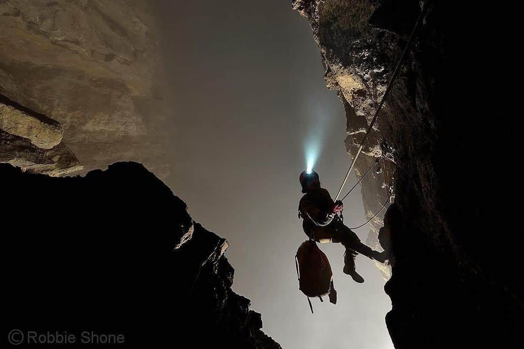 thephotosocietyさんのインスタグラム写真 - (thephotosocietyInstagram)「Photo by @shonephoto (Robbie Shone) // An American cave explorer ascends the final section of rope, approximately 300m (1000ft) high above the floor of a giant underground void full of fog. Discovered only a decade ago, we return to Cloud Ladder Hall in China, which ranks as one of the world’s largest cave chambers. How many more of these gigantic rooms exist out there, living in total darkness, just waiting to be found?」9月22日 13時31分 - thephotosociety