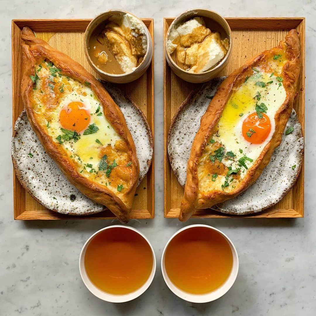 Symmetry Breakfastのインスタグラム：「Pide 🇹🇷 a Turkish flatbread with folded sides almost like a boat, filled with plenty of cheese 🧀an egg and a shed load of butter, the recipe is from my very own book too 👍🏼 The little bowl is some yoghurt with dark tahini and pomegranate molasses 👌🏼 At the end of this month I’m off to Turkey with @inflowsummits to talk about food in Instanbul but then will be checking out  Gaziantep and Şanlıurfa afterwards #symmetrybreakfast」