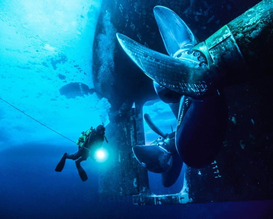 National Geographic Travelさんのインスタグラム写真 - (National Geographic TravelInstagram)「Photo by @paulnicklen | This is what it's like to get up close and personal with the Canadian Coast Guard's largest icebreaker to date, the C.C.G.S. Louis S. St-Laurent. I took this photo of Jeremy Stewart checking out the ship's propellers on my second assignment for @NatGeo back in 2002, which was a story on the effects of climate change in the Beaufort Sea, Alaska. So much has happened since then that it feels like a lifetime ago. But I'll never forget this moment when I got to fulfill a childhood dream of diving below multiyear ice to examine the mechanical majesty of this massive ship. Follow me @PaulNicklen for more images and stories from beneath the ice in both the Arctic and Antarctica. #BornToIce #SeaIce #ClimateChange #Underwater #Dive」10月12日 13時09分 - natgeotravel