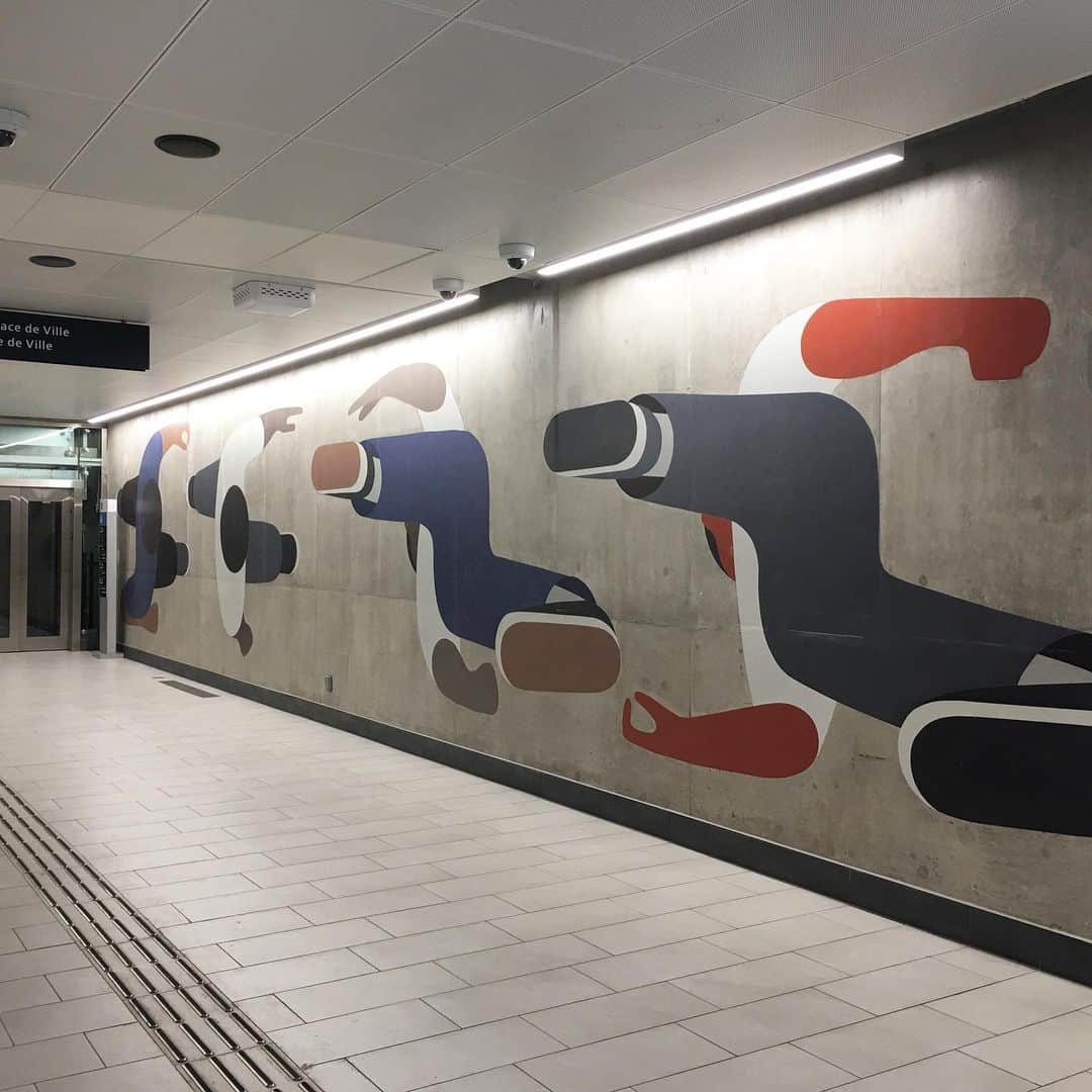 ジェフ・マクフェトリッジのインスタグラム：「Lyon Station, Ottawa Canada (2019) Commissioned by Ottawa Light Rail Transit the commission is many years in the making. Created as paint on raw concrete in order to have work that infiltrates as much of the two sided subterranean station as possible. Mostly figures formed into logos, humans as the typography in a landscape. Commission would not have happened without @coopercole thanks to @chencohendesigns for the iPhone tour of the station」