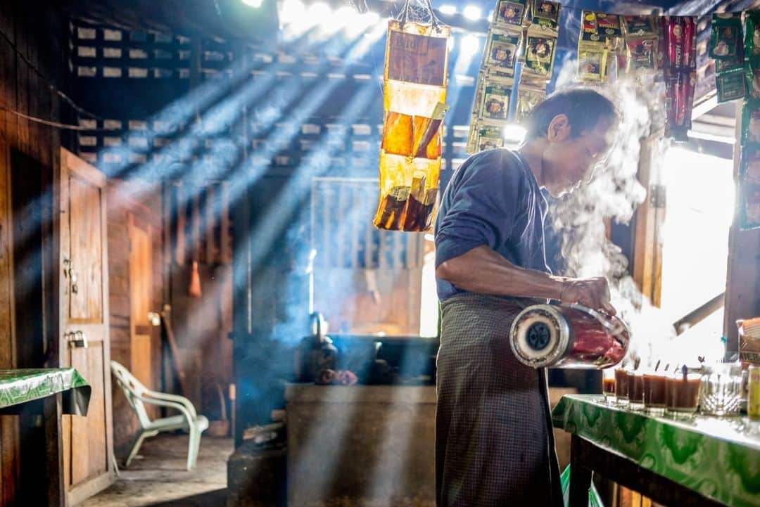 National Geographic Travelさんのインスタグラム写真 - (National Geographic TravelInstagram)「Photo by @coryrichards | Every culture has their form of a traditional beverage to welcome guests. While my expedition team and I crossed through Myanmar in an attempt to climb Hkakabo Razi, Myanmar’s highest mountain, we were welcomed with warm cups of chai. Pictured here, our warm welcome to town as our host pours us powerful mini cups of milky chai. Shot #onassignment for #natgeo. Follow me @coryrichards for more #travel, #adventure, and #culture from around the world.」10月15日 21時08分 - natgeotravel