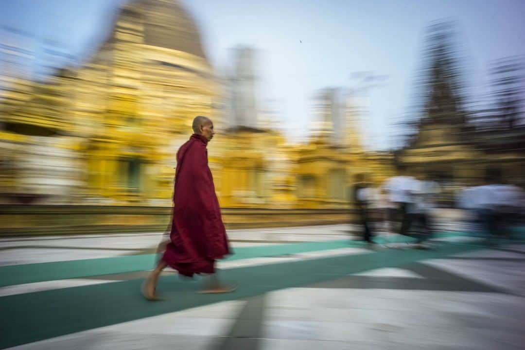 National Geographic Travelさんのインスタグラム写真 - (National Geographic TravelInstagram)「Photo by @coryrichards | Myanmar, also known as Burma, is the largest of the mainland Southeast Asian states. During an expedition for National Geographic, in an attempt to climb the highest mountain in the area, my team and I passed through Myanmar, through a jungle, to reach the base of our climb. Pictured here, a buddhist monk swiftly crosses temple grounds in Myanmar. Captured #onassignment for #natgeo. Follow me @coryrichards for more #travel, #culture, and #adventure from around the world.」10月19日 21時02分 - natgeotravel