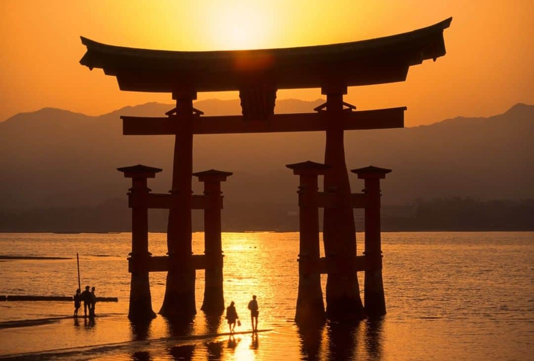 National Geographic Travelさんのインスタグラム写真 - (National Geographic TravelInstagram)「Photo by Michael Yamashita @yamashitaphoto | Itsukushima Shrine is one of the most famous places in Japan. You can’t miss seeing its giant torii at sunset. At high tide it appears to be floating on the sea; at low tide you can walk under it. The torii is believed to be the boundary between the spirit and the human worlds. #Hiroshima #miyajima #itsukushima #torii #itsukushimashrine」11月15日 14時09分 - natgeotravel