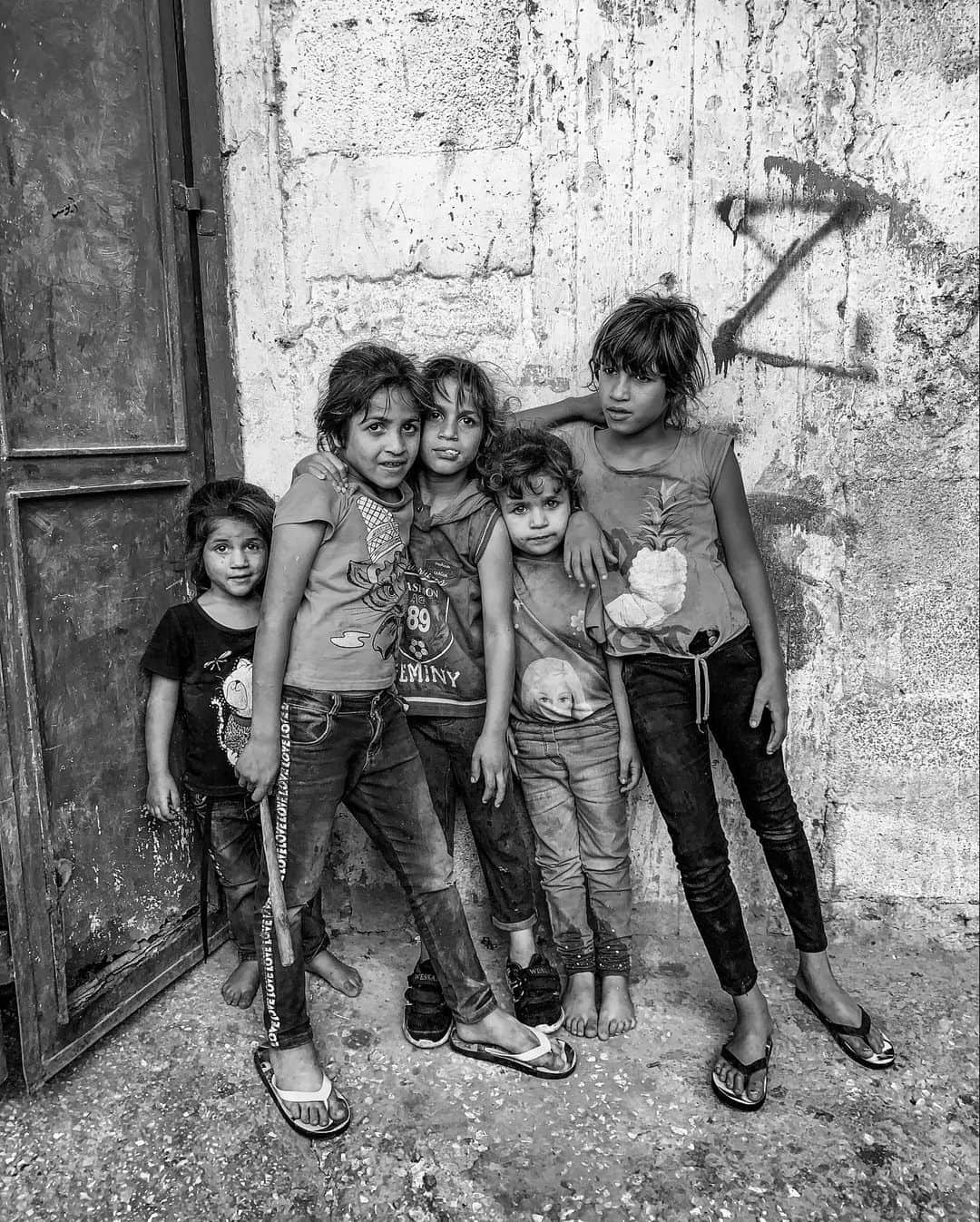 のインスタグラム：「Photos by @michaelchristopherbrown | Palestinian children in Balata Refugee Camp, the largest refugee camp in the West Bank. Balata has a population of 30,000 residents in a .25-square-kilometer area, the majority of whom are under age 25. In 1950 the UN gave these refugees, originally from Jaffa, shelter in this tiny area near Nablus, which is now densely populated. The United Nations Relief and Works Agency for Palestine Refugees in the Near East, which last year was subject to hundreds of millions of dollars in budget cuts by the Trump administration, funds a school in the Balata camp with approximately 5,000 pupils. Other programs include the Yaffa Cultural Center, which operates a guesthouse, children’s theater and cinema, children’s library and media center, but with the budget cuts, it's seeking donors to fund the center. From 1980s through the early 2000s, Balata residents played a leading role in the first and second intifadas.」