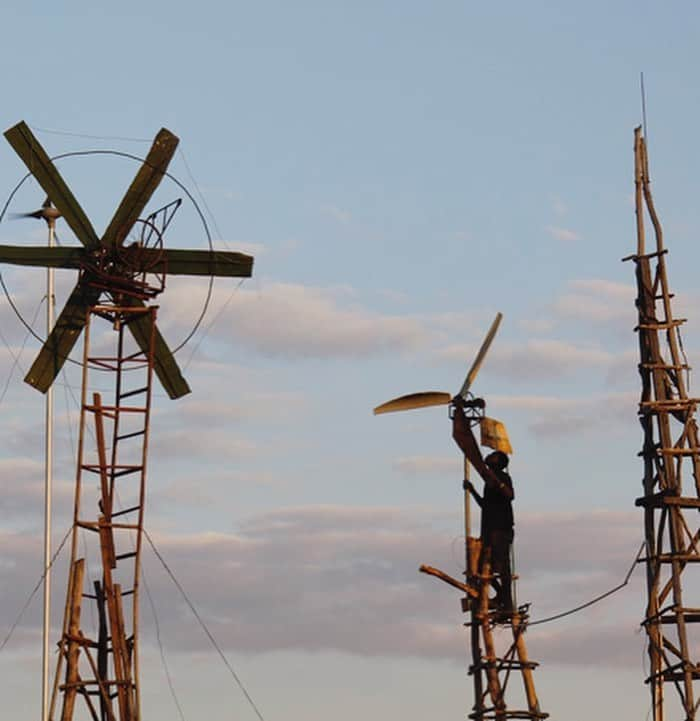 シャーロット・ケンプ・ミュールさんのインスタグラム写真 - (シャーロット・ケンプ・ミュールInstagram)「Modern day Don Quixote- William Kamkwamba’s village was on the verge of starvation from the drought. He was kicked out of school when he couldn't pay a few dollars in school fees, so he spent his days at the library instead, where he found a book with photographs of windmills... The then-14-year-old taught himself to build makeshift wind turbines. He scoured through junkyards for items, including bicycle parts, plastic pipes, tractor fans and car batteries. For the tower, he collected wood from blue-gum trees. “Everyone laughed at me when I told them I was building a windmill. They thought I was crazy.” That was 2002. Now, he has five windmills, the tallest at 37 feet. He built one at an area school that he used to teach classes on windmill-building. The windmills generate electricity and pump water in his hometown, north of the capital, Lilongwe. Neighbors regularly trek across the dusty footpaths to his house to charge their cellphones. Others stop by to listen to Malawian reggae music blaring from a radio that he helped power. He saved his entire village from starvation. He even improved upon the original design. #BeABossNotABitch」11月17日 3時56分 - charlottekempmuhl