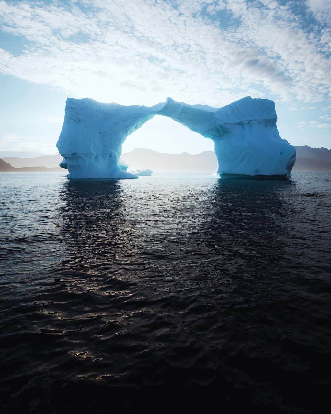 Alex Strohlさんのインスタグラム写真 - (Alex StrohlInstagram)「We came to South Greenland in part to sail among Icebergs. This is one of the most remarkable ones we saw on our trip. For a moment we thought about driving the boat through the arch to get a closer look at it but the captain quickly deterred us from it from fears of it collapsing on us.. What a beast」11月17日 0時04分 - alexstrohl
