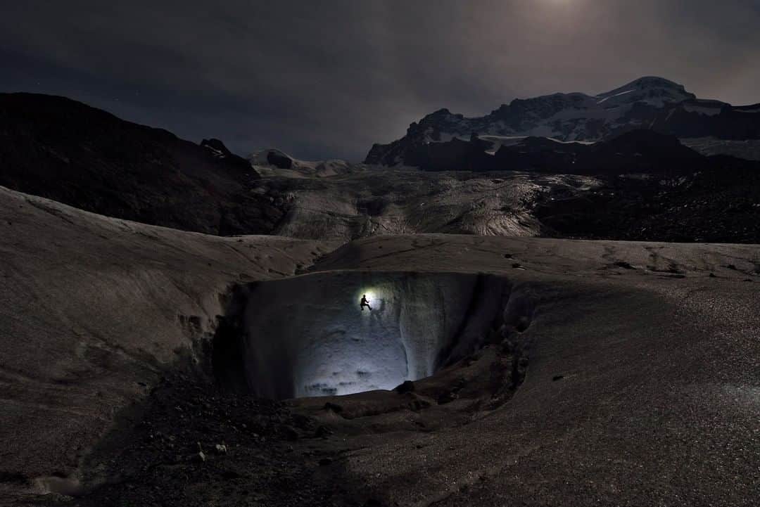 National Geographic Travelさんのインスタグラム写真 - (National Geographic TravelInstagram)「Photo by Robbie Shone @shonephoto | An isolated cave explorer begins his descent into the depths of the Gorner Glacier in Switzerland. In the dead of night, when the temperatures are cold and there is no meltwater, these moulins are safe to access.  @NatGeoImageCollection」11月17日 10時04分 - natgeotravel