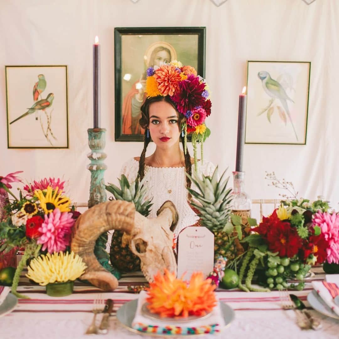 ミナのインスタグラム：「Happy Halloween everyone! 🎃 Beautiful Sophie is wearing our Minna dress in this gorgeous Day of the dead and Frida Kahlo -inspired shoot ❤ . . . . Photography: @weheartpictures  Art Direction, Styling & Co-ordination: @mrandmrsunique  Marquees, Props and Location: @arabiantents  Flowers: @thebasementflorist  Cake & Cupcakes: @neviepie  Stationery: @russetandgray  Make Up: The Beauty Aisle  Hair: @simplybeautifulweddinghair Jewellery: @pollywales  Mexican textiles (table linen, bag, bed throw, lampshades, cushions): @montesandclark  Model: Sophie from @lenisagency . . . . #weddingdresses #bridaldresses #alternativewedding #weddings2020 #weddinginspiration #weddings #fridakahlobride #sustainablewedding #sustainableweddingdress #handmadeweddingdress #ethicalwedding #indiebridelondon #handmadeweddingdress #vintageinspiredweddingdress #festivalbride #barnwedding #autumnwedding #bohemianwedding #bohemianweddingdress #bohoweddingdress #bohowedding #laidbackwedding #fridakahlostyle #londonwedding #ukwedding #rusticwedding #farmwedding #halloweenwedding #dayofthedeadwedding」