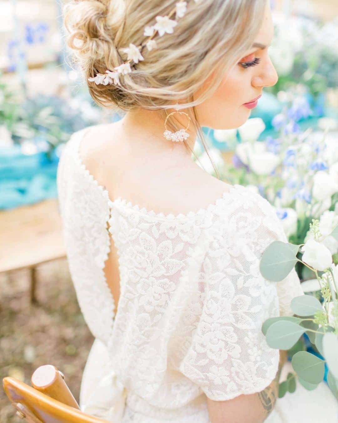 ミナのインスタグラム：「Hello Friday and welcome weekend! We're uploading the last pictures of the new collection of long dresses on the website. Release tomorrow, super exciting!  Among other luxurious materials, the new collection will feature dresses made of this gorgeous floral, organic cotton lace 😍  Photographer: @nataliestevensonphoto  Flower and styling: @saras.events.flowers  Stationery: @tiggityboo  Candles: @kissaircandles  Chairs/table, cutlery: @classiccrokery  Linen Napkins: @queenandeden  Accessories: @rachelsokhalbridal  MUA and Hair style: @itsdianamua  Model: @jojo_ellenx  #weddingdresses #bridaldresses #bridal #alternativewedding #weddings2020 #weddinginspiration #weddings #ethicalweddingdress #sustainablewedding #sustainableweddingdress #handmadeweddingdress #ethicalwedding #indiebridelondon #handmadeweddingdress #vintageinspiredweddingdress #festivalbride #barnwedding #naturewedding #bohemianwedding #bohemianweddingdress #bohoweddingdress #bohowedding #laidbackwedding #diywedding #londonwedding #ukwedding #rusticwedding #farmwedding #summerwedding #organiccottondress」