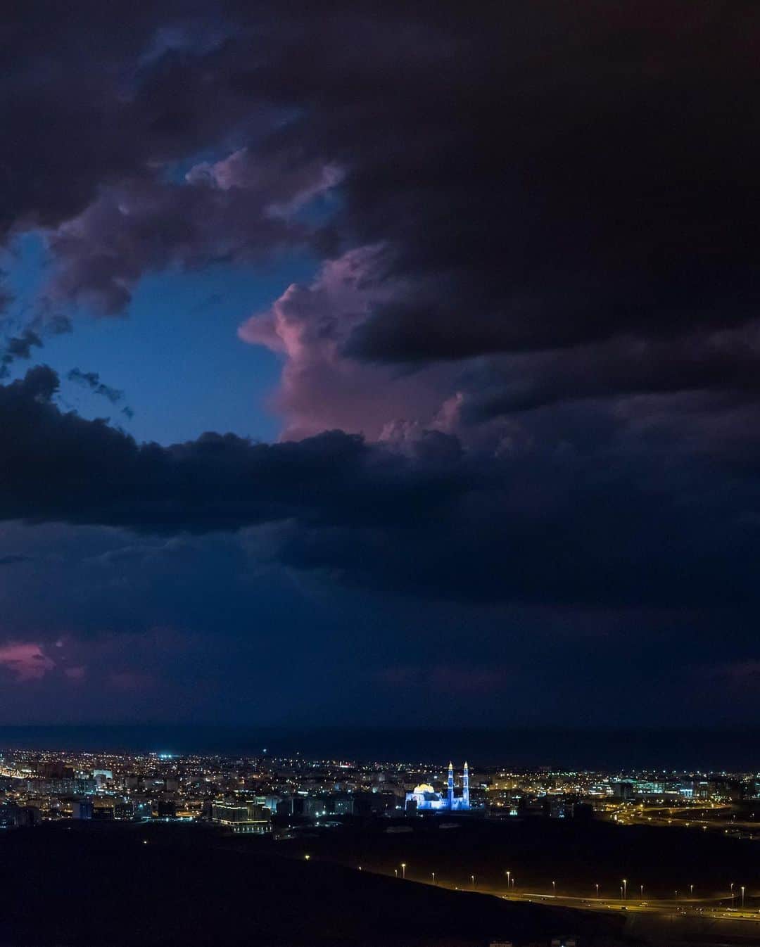 National Geographic Travelさんのインスタグラム写真 - (National Geographic TravelInstagram)「Photo by @BabakTafreshi | Swipe slowly to see the entire view of this evening twilight over the coastal city of Muscat, with skies clearing after a stormy day. With about 1.5 million residents, Muscat is home to a third of Oman's population. #nightphotography #oman #muscat #middleeast」11月12日 2時07分 - natgeotravel