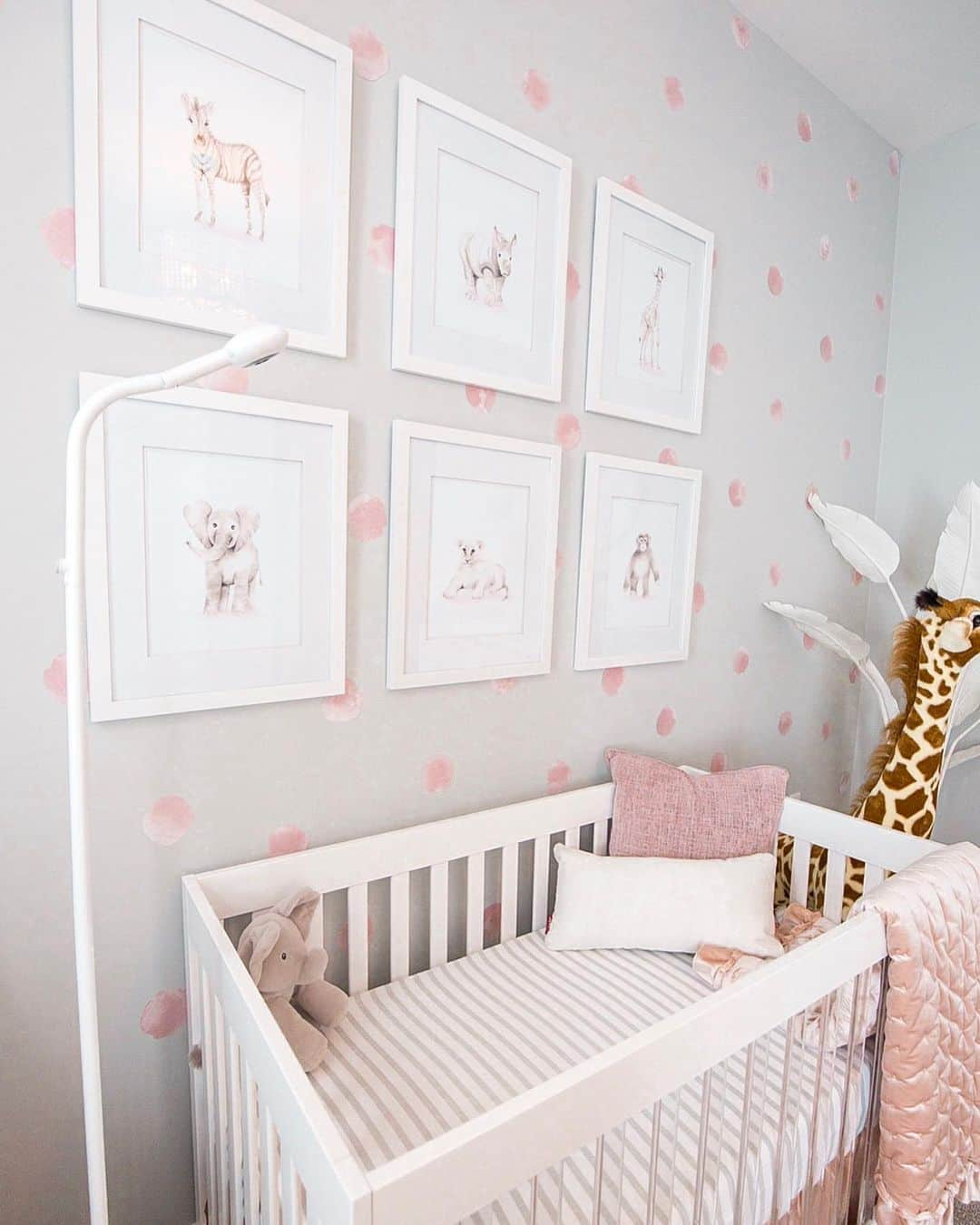 Paige Hathawayさんのインスタグラム写真 - (Paige HathawayInstagram)「New crib, who dis 😝  I’ve been dying to share Presley’s nursery with you and it’s been highly requested as a post... So I’ll be sharing all the details this week (here and stories) along with some GIVEAWAYS!! (stay tuned) Its just me doing her nursery but I think I did a pretty solid job!! Wanting to add a few more pieces but this is what we have so far... It was important to me for Jason to have an input, so he picked the animal theme and I went with it making it as girly as possible! We used light pinks, greys and whites to make her room elegant, feminine and plush. Plenty to draw the eye! I wanted to feel good when we walked into her room and she absolutely loves playtime here!🦒💗🦓💗🐆 WHAT THEME IS YOUR NURSERY?  Crib and Mattress: @babyletto  Glider and Ottoman: @Montedesign  Animal paintings: @nickystudioq White buju: @samanthabowenco Chandelier: @reginaandrewdetroit  Wall Decalls: @urbanwalls  Baby Monitor: @Get_nanit  Any questions? Happy to help - Ask them below!」11月12日 2時25分 - paigehathaway