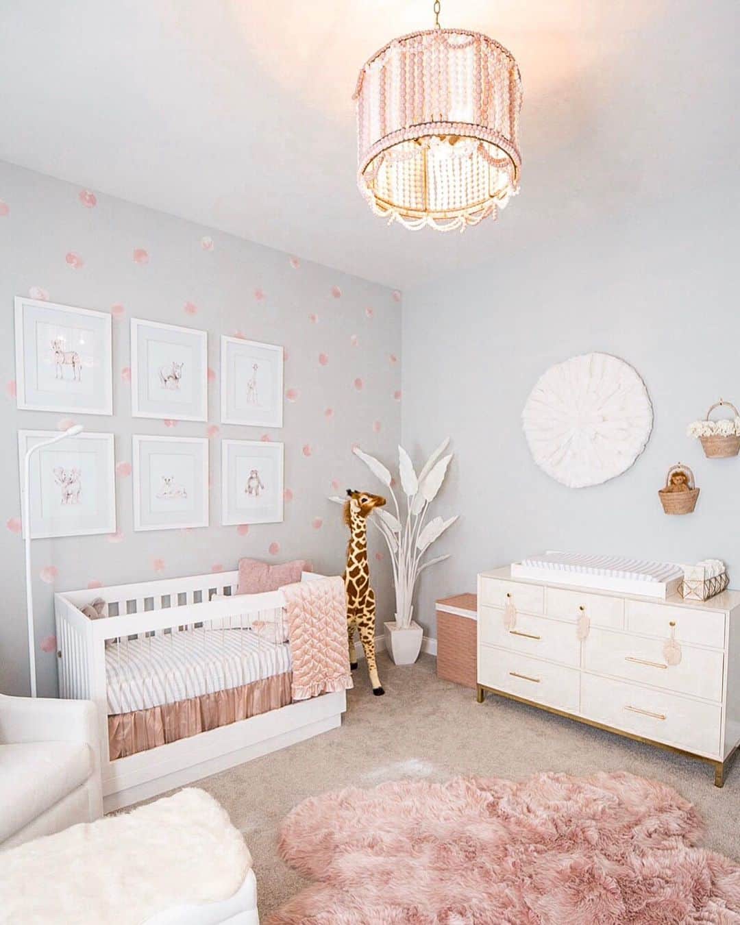 Paige Hathawayさんのインスタグラム写真 - (Paige HathawayInstagram)「New crib, who dis 😝  I’ve been dying to share Presley’s nursery with you and it’s been highly requested as a post... So I’ll be sharing all the details this week (here and stories) along with some GIVEAWAYS!! (stay tuned) Its just me doing her nursery but I think I did a pretty solid job!! Wanting to add a few more pieces but this is what we have so far... It was important to me for Jason to have an input, so he picked the animal theme and I went with it making it as girly as possible! We used light pinks, greys and whites to make her room elegant, feminine and plush. Plenty to draw the eye! I wanted to feel good when we walked into her room and she absolutely loves playtime here!🦒💗🦓💗🐆 WHAT THEME IS YOUR NURSERY?  Crib and Mattress: @babyletto  Glider and Ottoman: @Montedesign  Animal paintings: @nickystudioq White buju: @samanthabowenco Chandelier: @reginaandrewdetroit  Wall Decalls: @urbanwalls  Baby Monitor: @Get_nanit  Any questions? Happy to help - Ask them below!」11月12日 2時25分 - paigehathaway