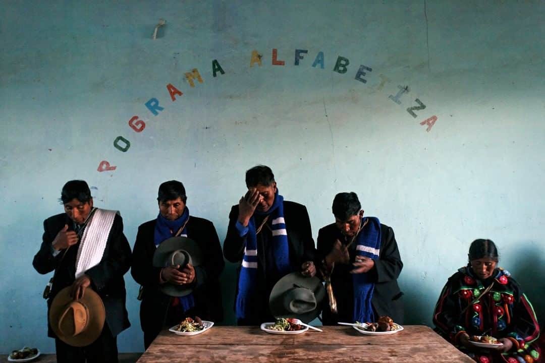 のインスタグラム：「Photo by Ivan Kashinsky @ivankphoto | People cross themselves before a meal during an indigenous fiesta in the province of Huancané, near Lake Titicaca, Perú. This photo was part of book project in which Karla Gachet and I traveled from the Equator to the southern tip of South America.」