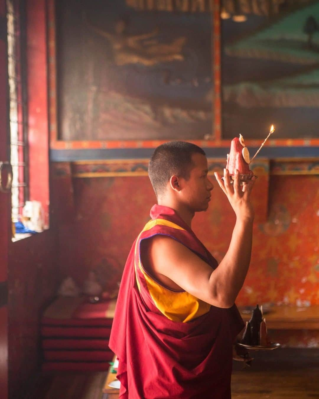 National Geographic Travelさんのインスタグラム写真 - (National Geographic TravelInstagram)「Photo by @emilypolar | A young monk offers a torma at Shechen Monastery in Nepal during a ceremony for the deceased. A torma is a ritual cake, usually hand-molded from butter and barley flour, used in Tibetan Buddhism. The symbolism varies depending on the purpose. The word "torma" means to cast away, break up, or scatter. This implies both a sense of offering and of letting go.  To see more of Nepal and beyond follow me @emilypolar. #Nepal #TibetanBuddhism #Boudha」11月12日 18時09分 - natgeotravel