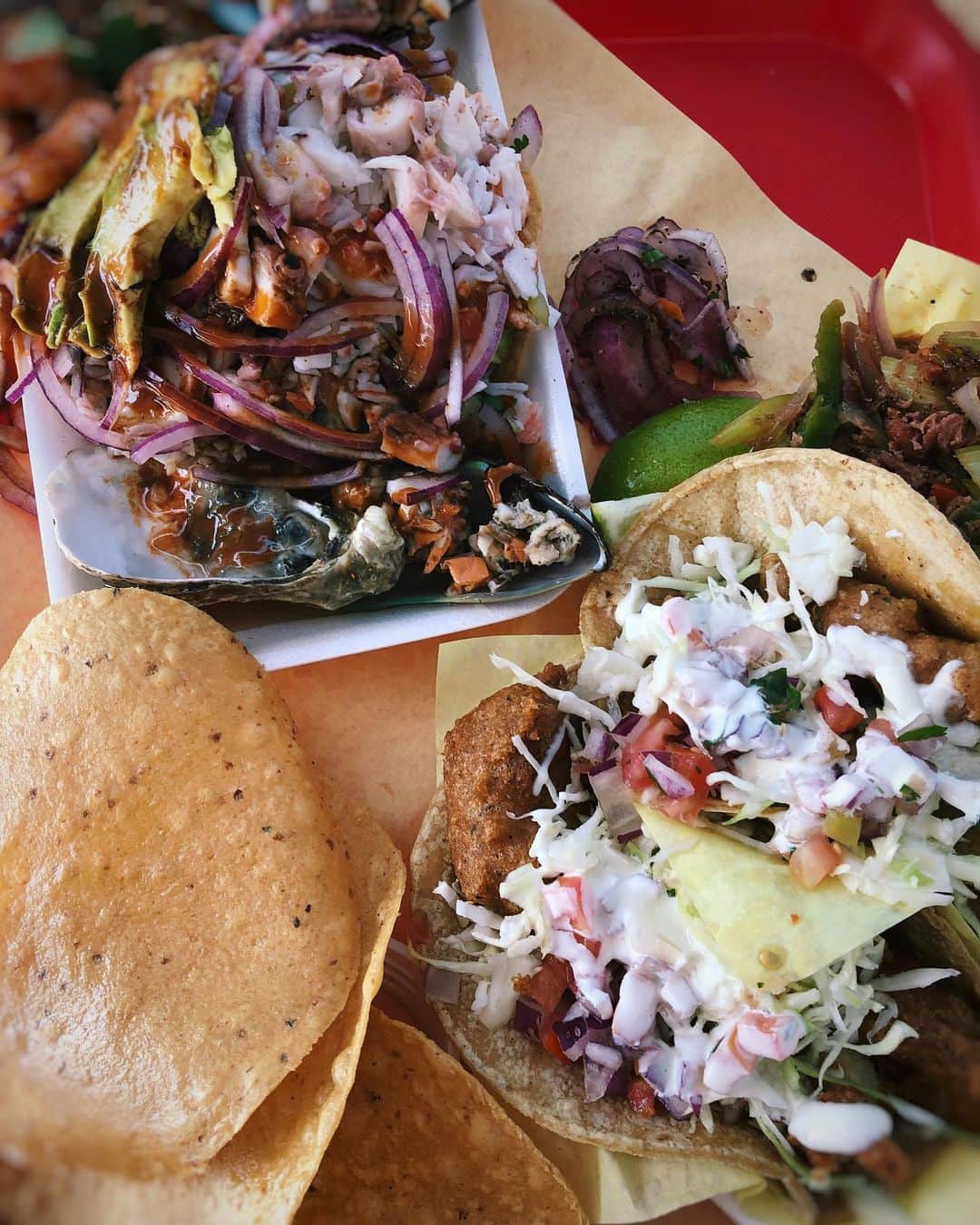Antonietteのインスタグラム：「Tostada Tuesday! Oh and tacos too! This place is known for their crazy seafood tostada which is a variety of seafood  piled high and served with crunchy tostadas on the side to scoop up all that deliciousness. The fish tacos are one of my fave places to go in San Diego and are always under $2. The complimentary seafood consommé  helps to whet your appetite beforehand. No seating, just a few tables scattered around and it can get busy, but just prepare to eat at your car with some napkins in tow! 😋」