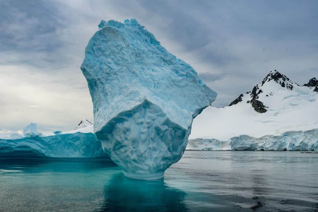 National Geographic Travelさんのインスタグラム写真 - (National Geographic TravelInstagram)「Photo by @michaelmelford | We came upon this beautiful iceberg while cruising along the west side of the Antarctic Peninsula. Visitors to Antarctica see the effects of climate change every year, but I find the effects to be even more drastic in the Arctic. #antarctica #ice #wilderness」12月12日 22時07分 - natgeotravel