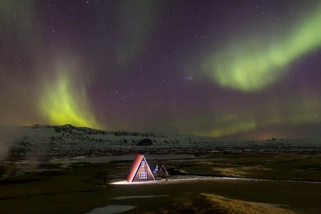 National Geographic Travelさんのインスタグラム写真 - (National Geographic TravelInstagram)「Photo by @robert_ormerod | A triangular house near Húsavík, Iceland, is lit by a head torch as the aurora borealis fills the winter sky.」12月12日 18時08分 - natgeotravel