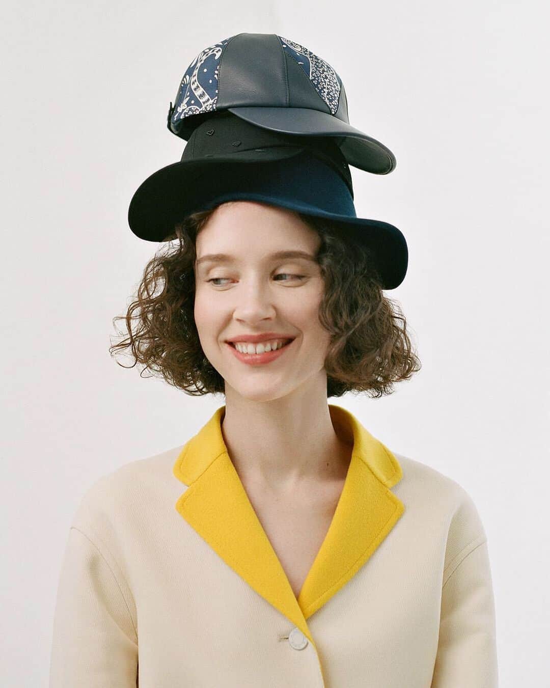 のインスタグラム：「Tuesday 5pm. Un-fitting n°2. Putting on a pyramid of caps. What’s your record? #threeforone #haircare #styledcaps #highlightmylife #hermes #cap  Photography by @camilafalquez Styled by @jaimekaywaxman」