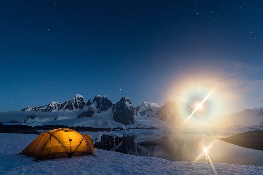 National Geographic Travelさんのインスタグラム写真 - (National Geographic TravelInstagram)「Photo by @daisygilardini | Witnessing a full moon rising on the horizon while camping on Hovgaard Island in the Antarctic Peninsula will always be one of the highlights of my time on the White Continent.  I didn’t get much sleep during this night because I wanted to see it all. I was excited and mesmerized by such beauty. It was around 4 a.m., when clouds obscured the moon and stars, that I finally got some rest. Follow me @DaisyGilardini for more images and stories behind the scenes. #camping #antarctica #fullmoon #adventure」11月20日 18時08分 - natgeotravel